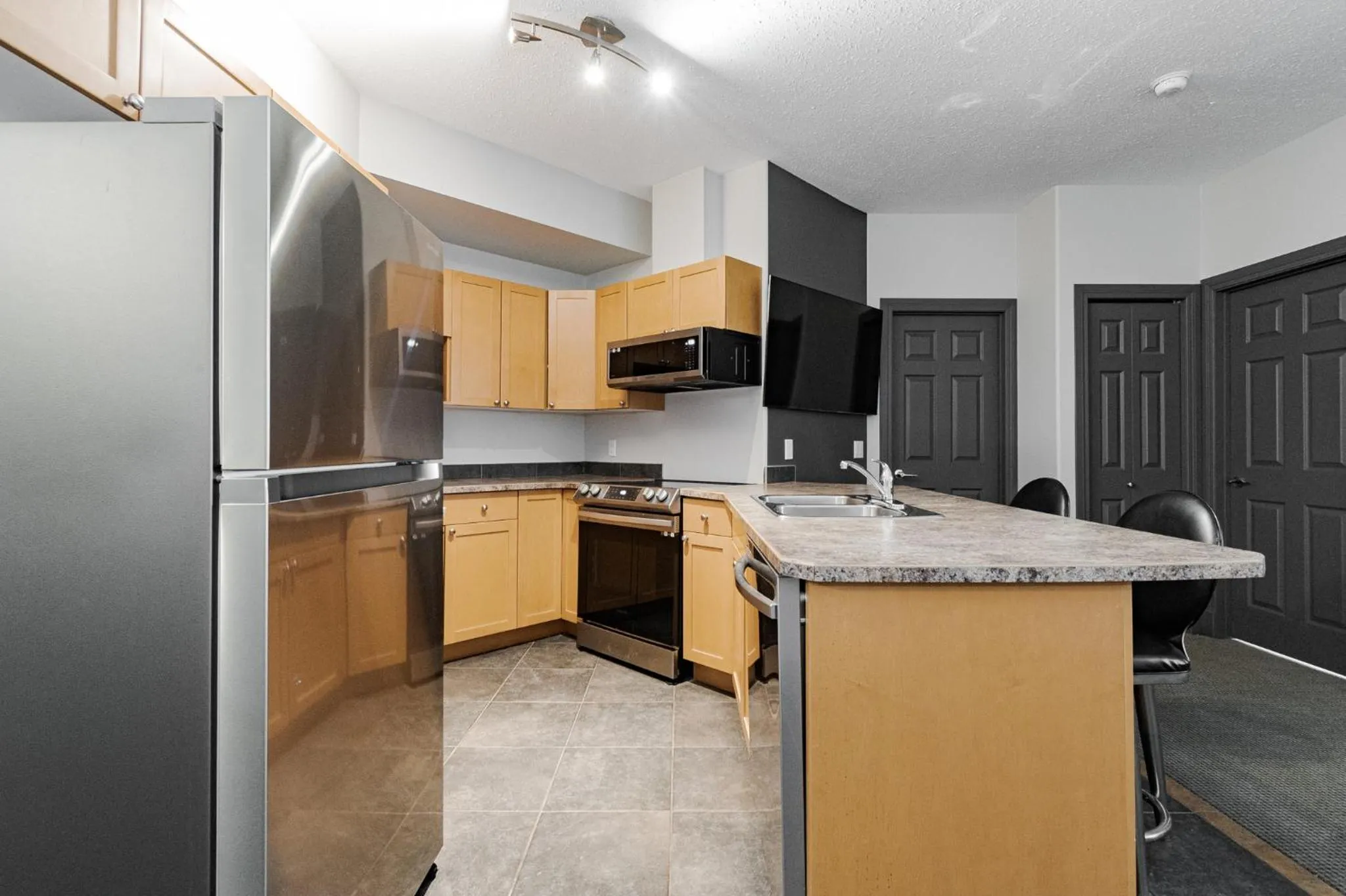 Kitchen or kitchenette in Premier Residence - Fort McMurray