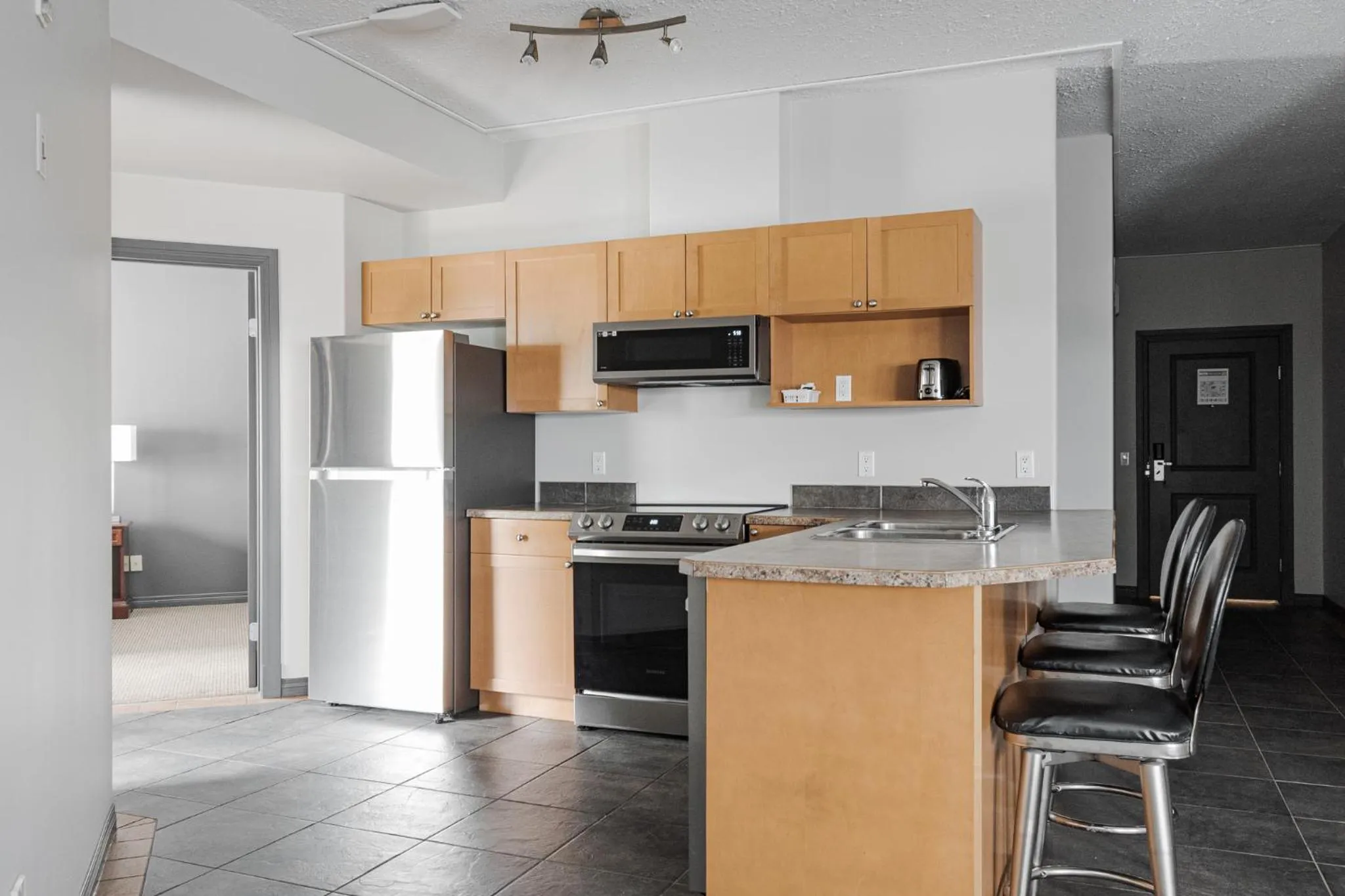 Kitchen or kitchenette in Premier Residence - Fort McMurray
