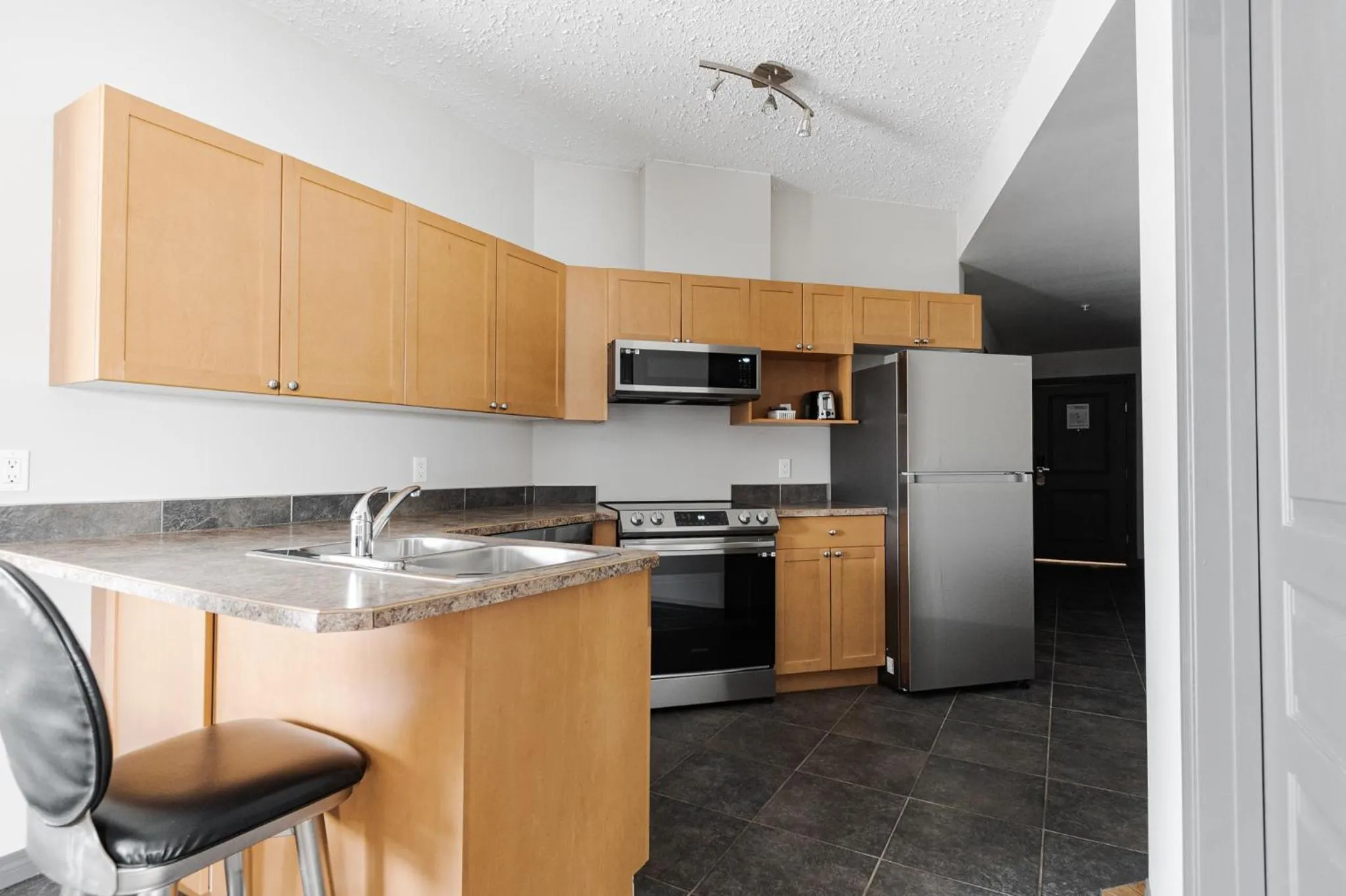 Kitchen or kitchenette in Premier Residence - Fort McMurray