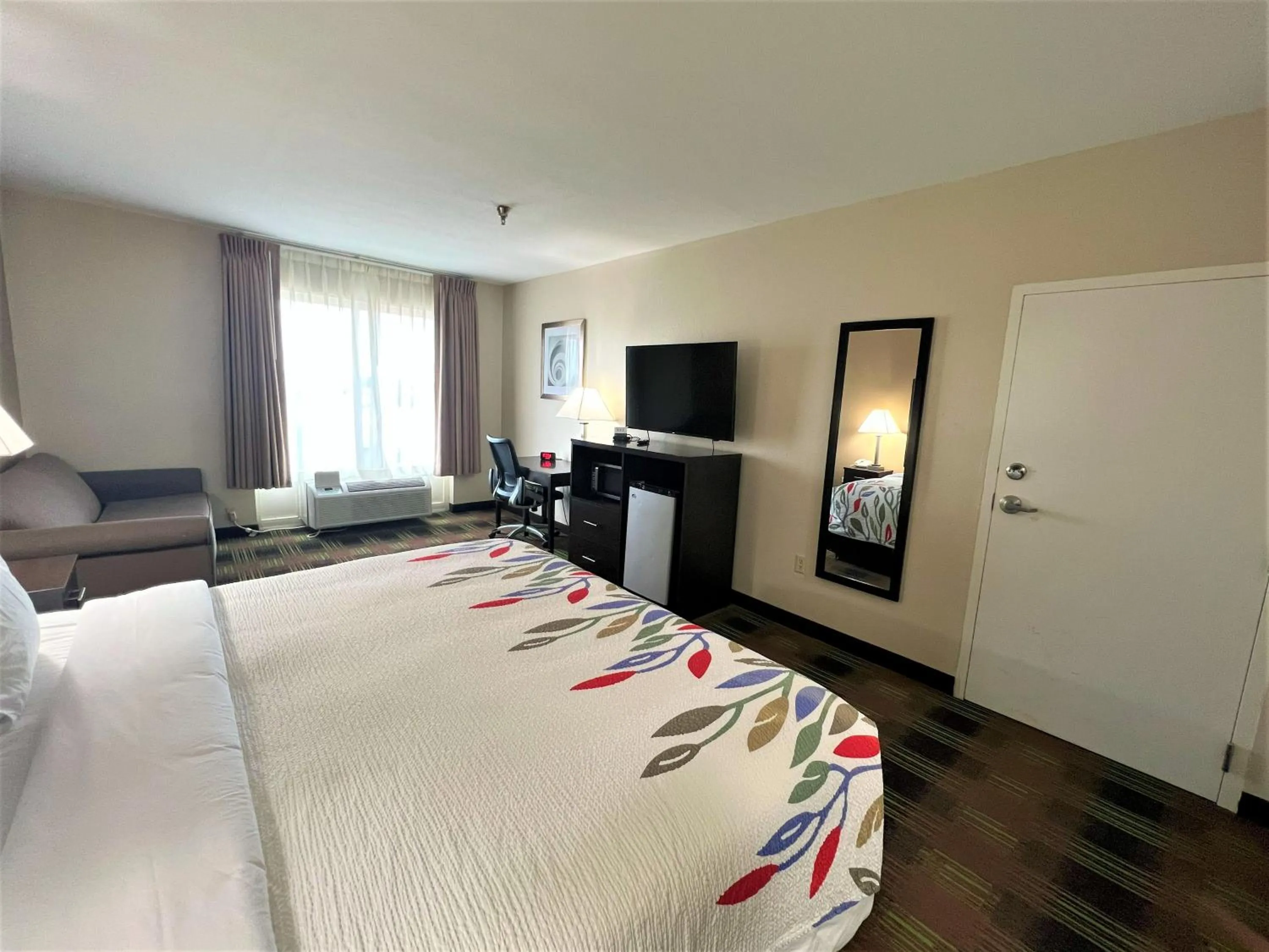 Bed in Trident Inn & Suites New Orleans