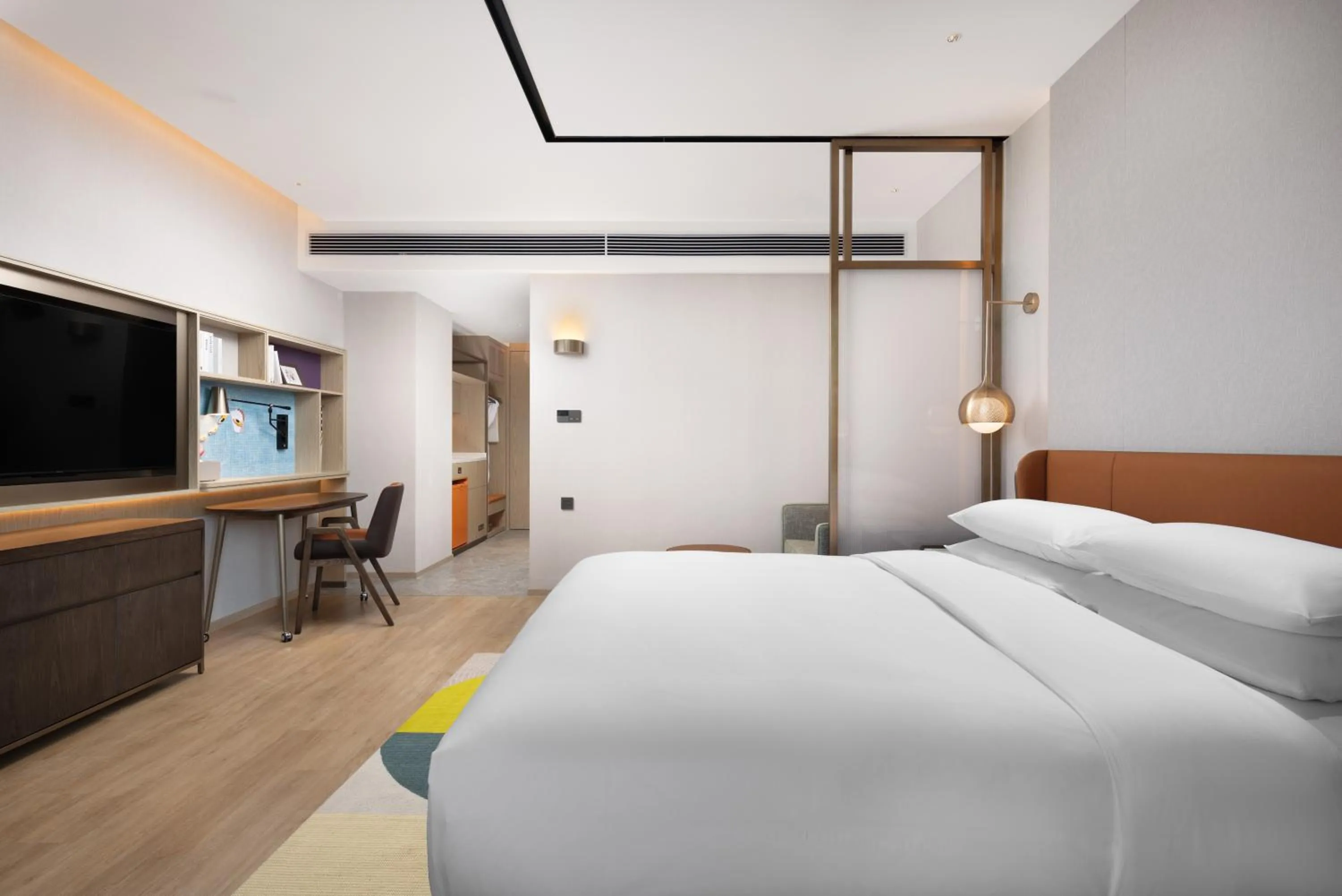 Communal lounge/ TV room, Bed in Home2 Suites by Hilton Guiyang Guanshanhu