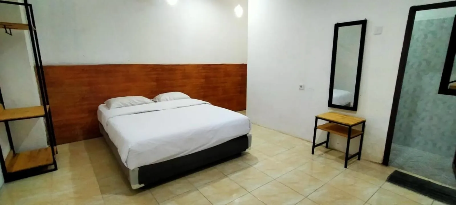 Bed in HER MANDIRI GUEST HOUSE