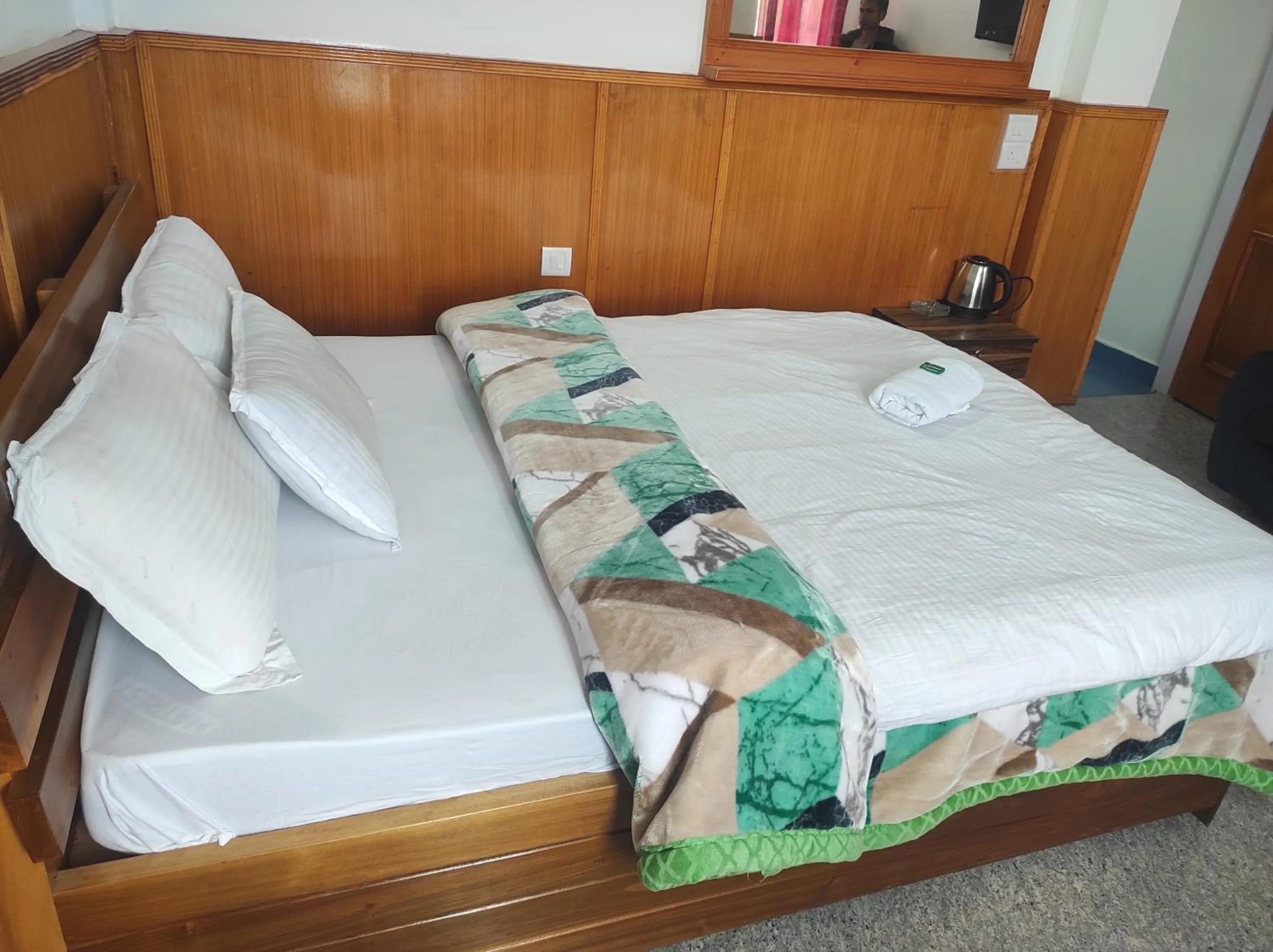 Bed in Hotel Tawang Regency