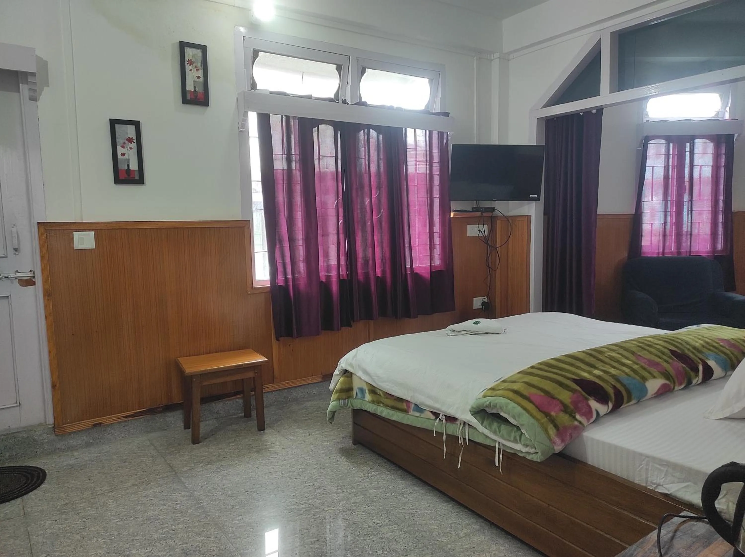 Bed in Hotel Tawang Regency