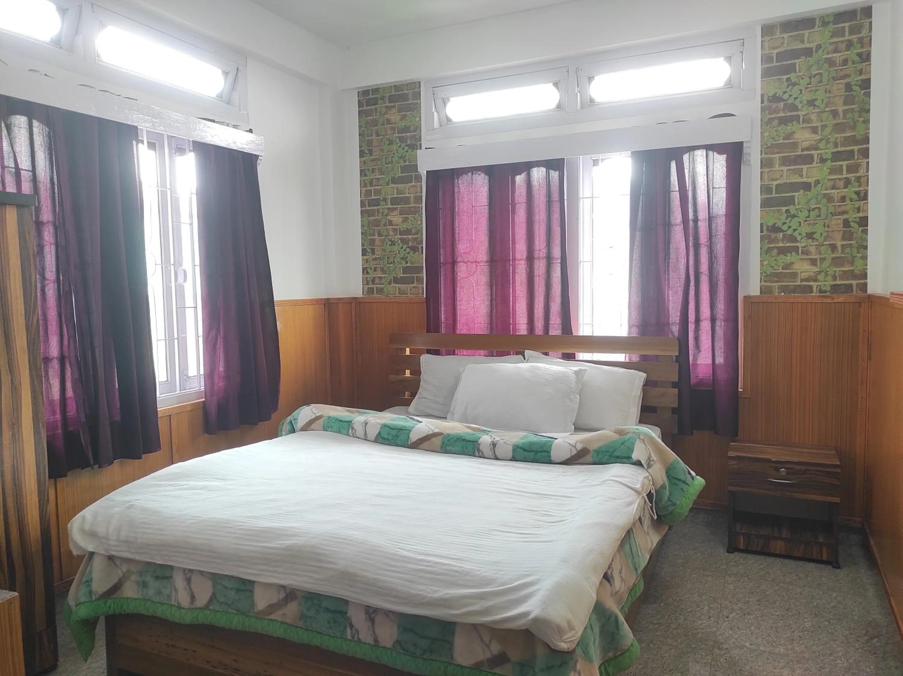 Bed in Hotel Tawang Regency