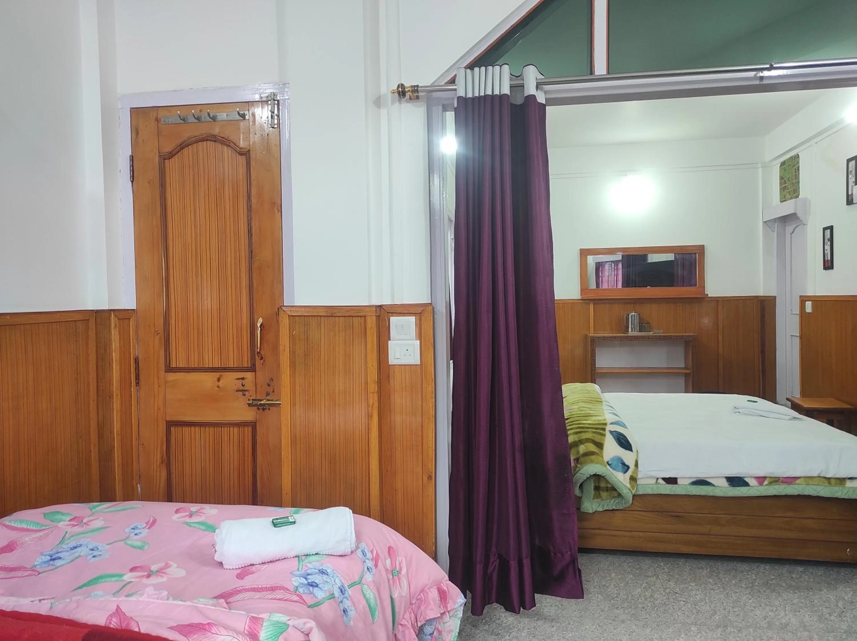 Bed in Hotel Tawang Regency