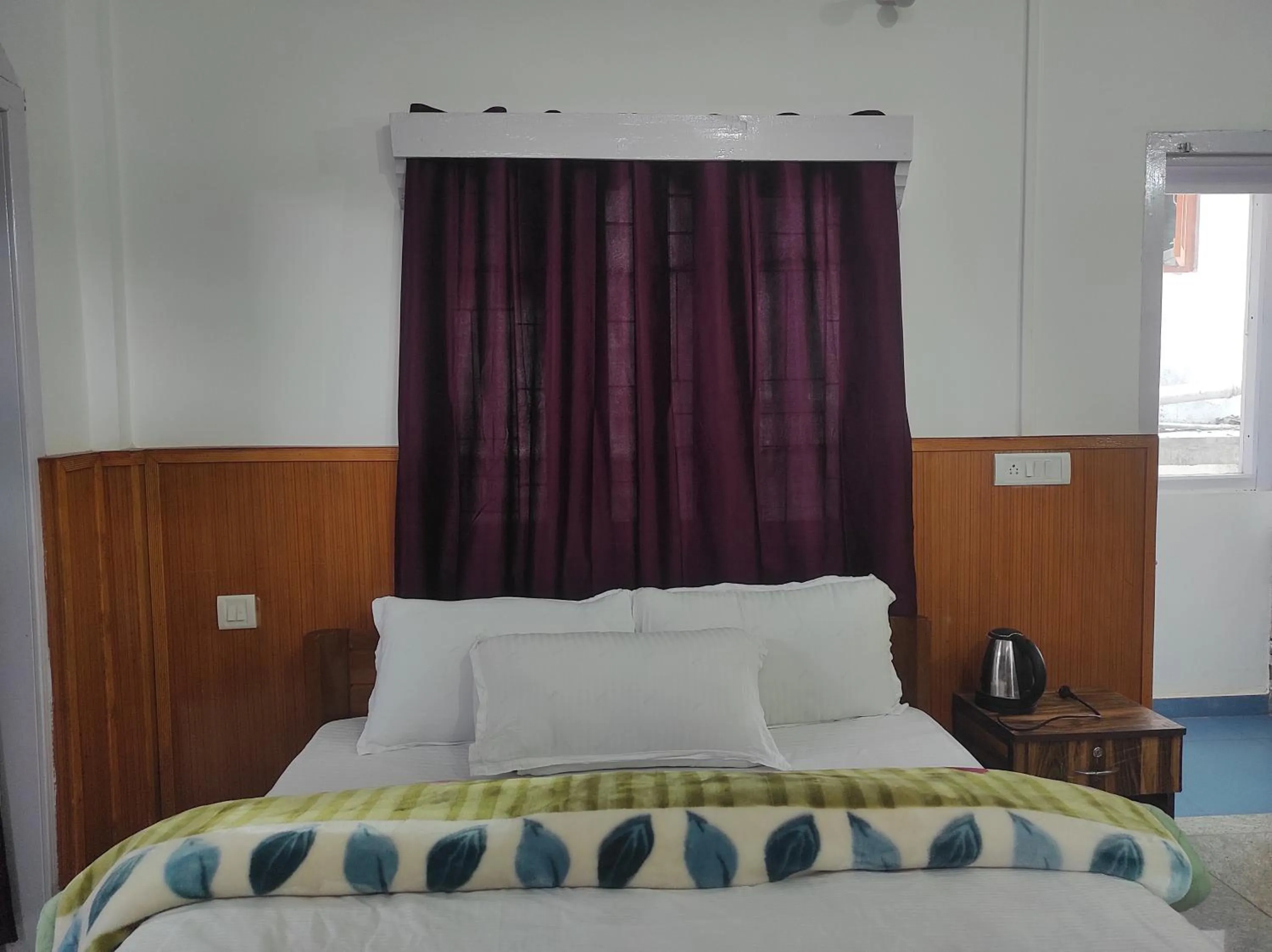 Bed in Hotel Tawang Regency
