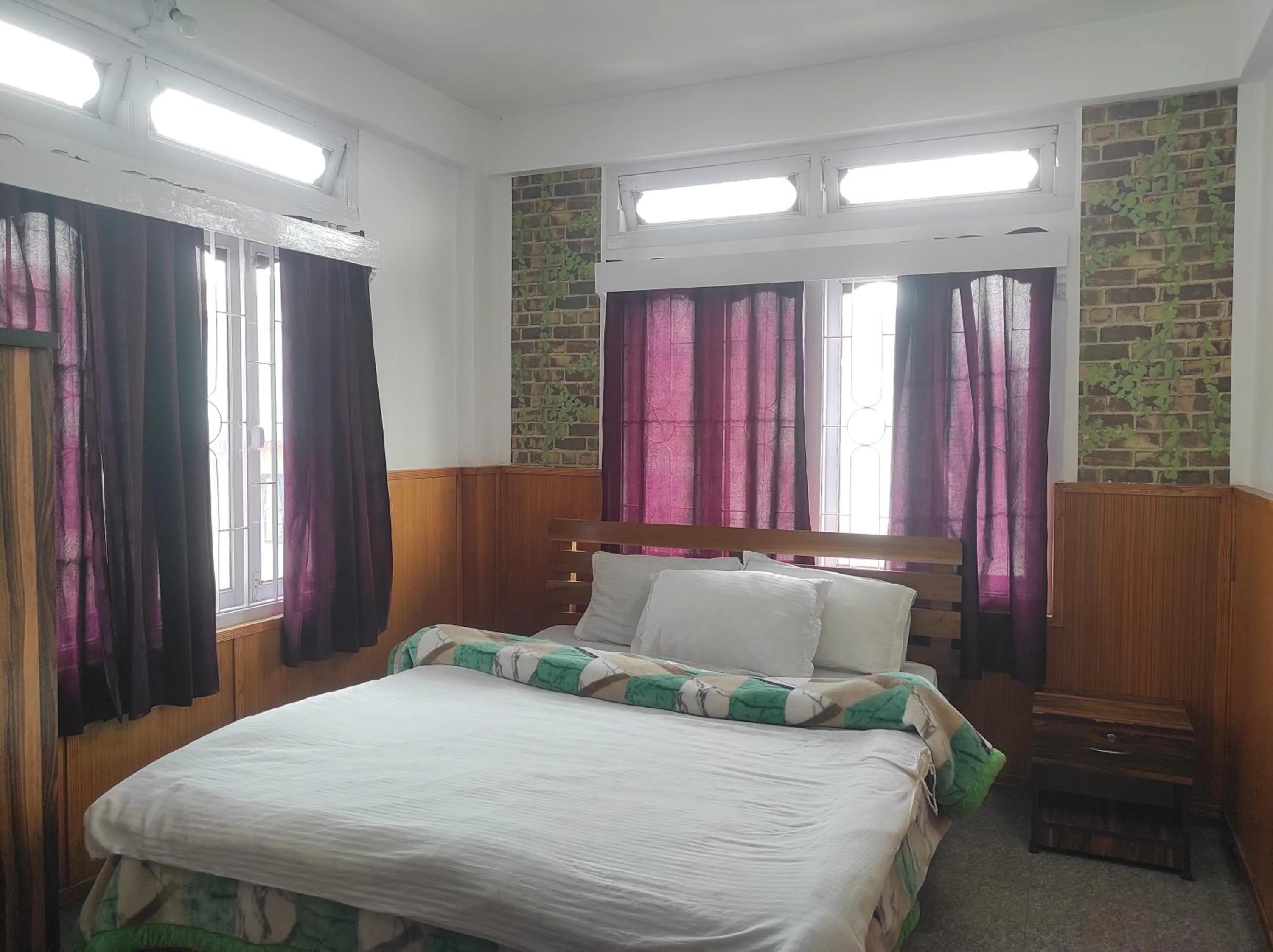 Bed in Hotel Tawang Regency