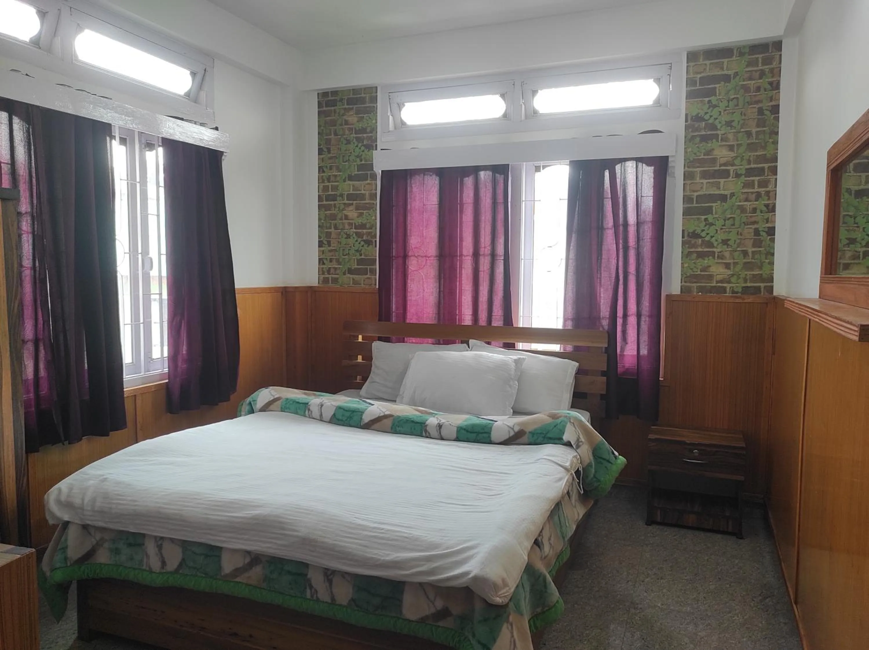 Bed in Hotel Tawang Regency