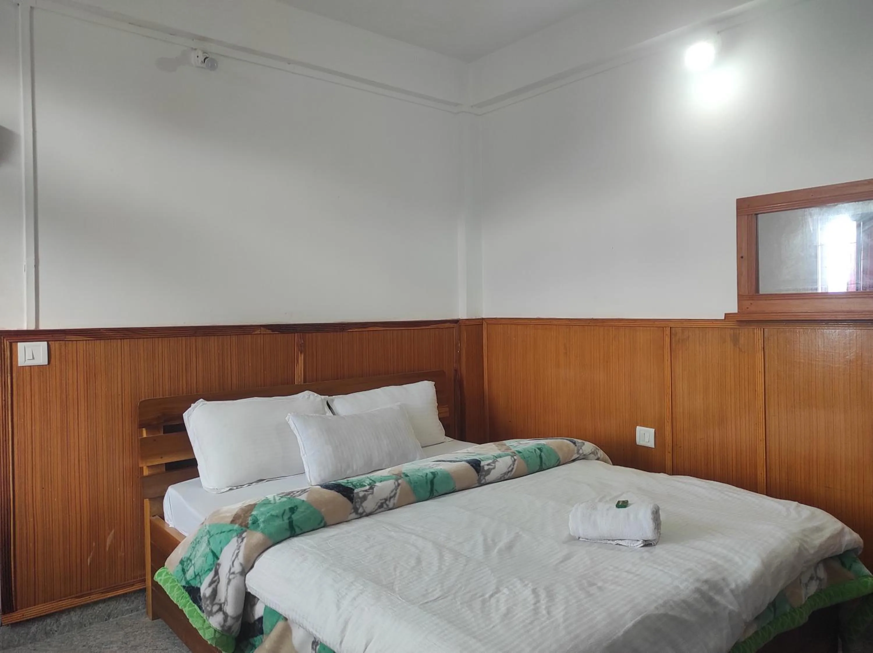Bed in Hotel Tawang Regency