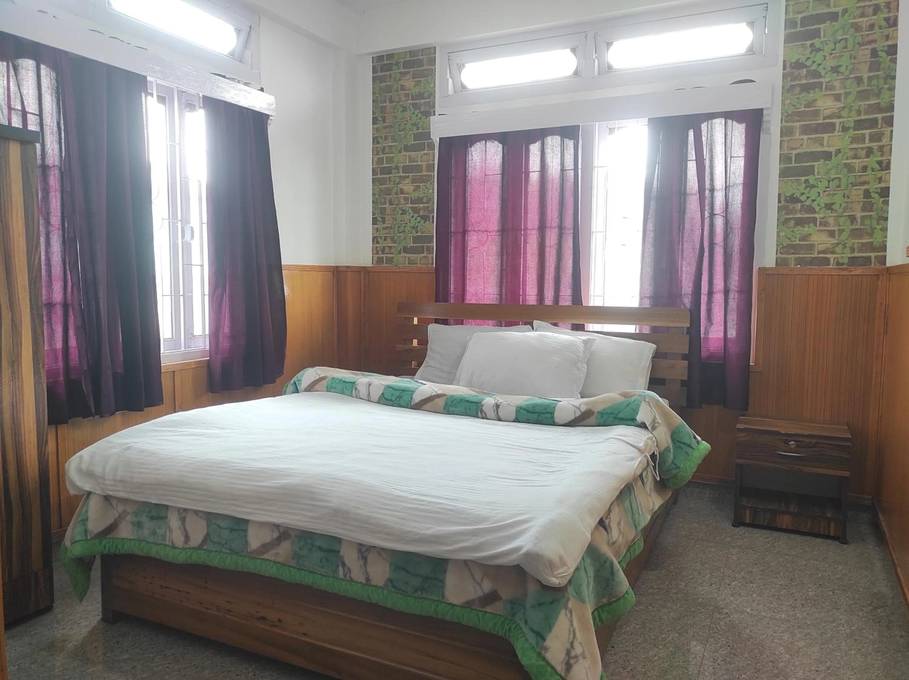 Bed in Hotel Tawang Regency