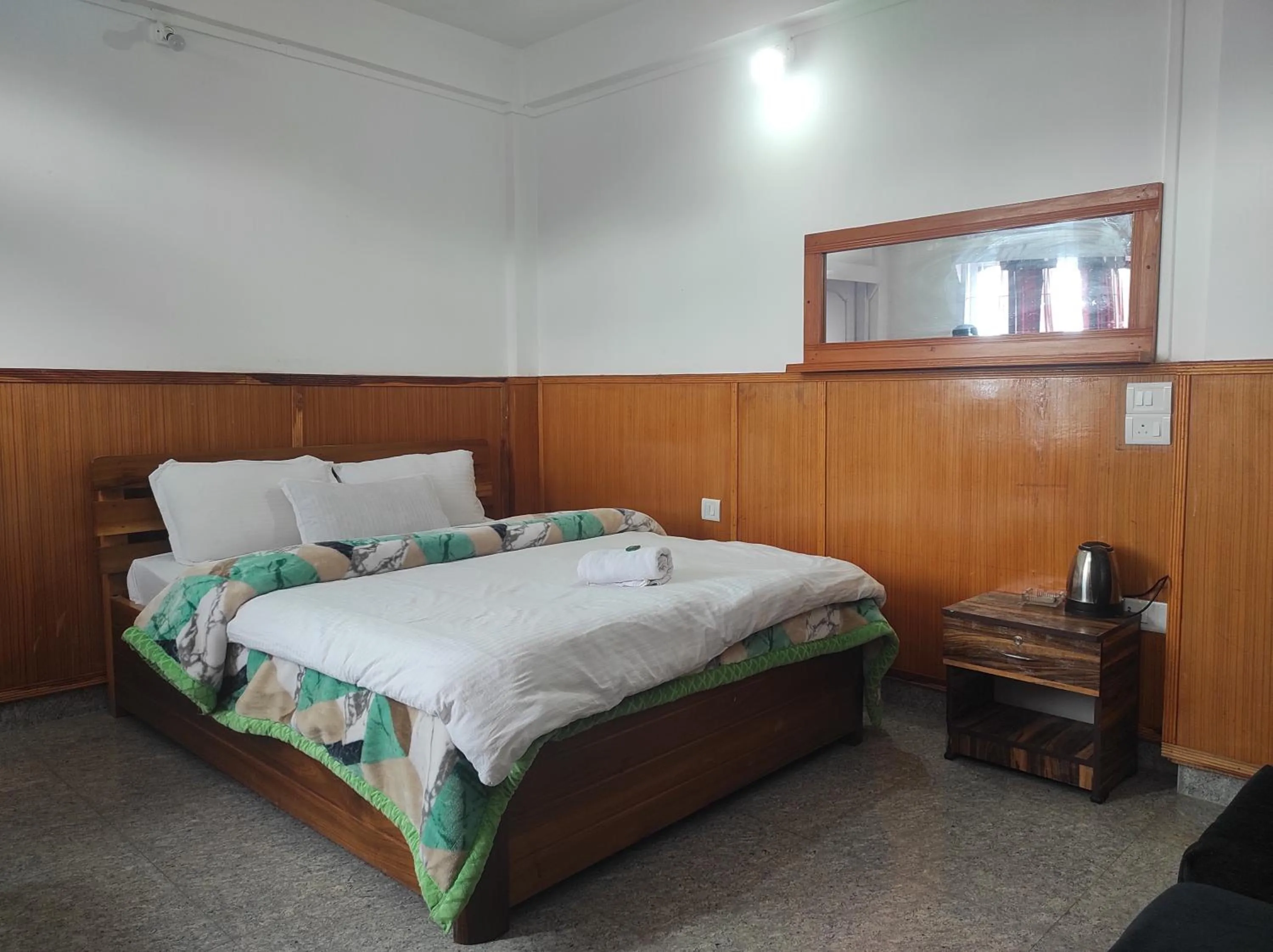 Bed in Hotel Tawang Regency