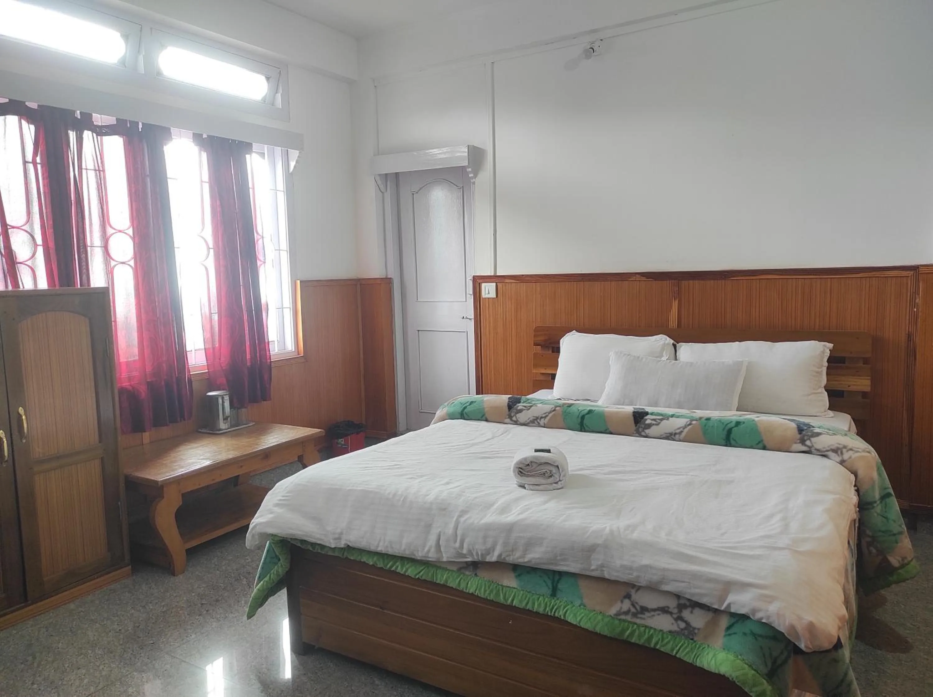 Bed in Hotel Tawang Regency