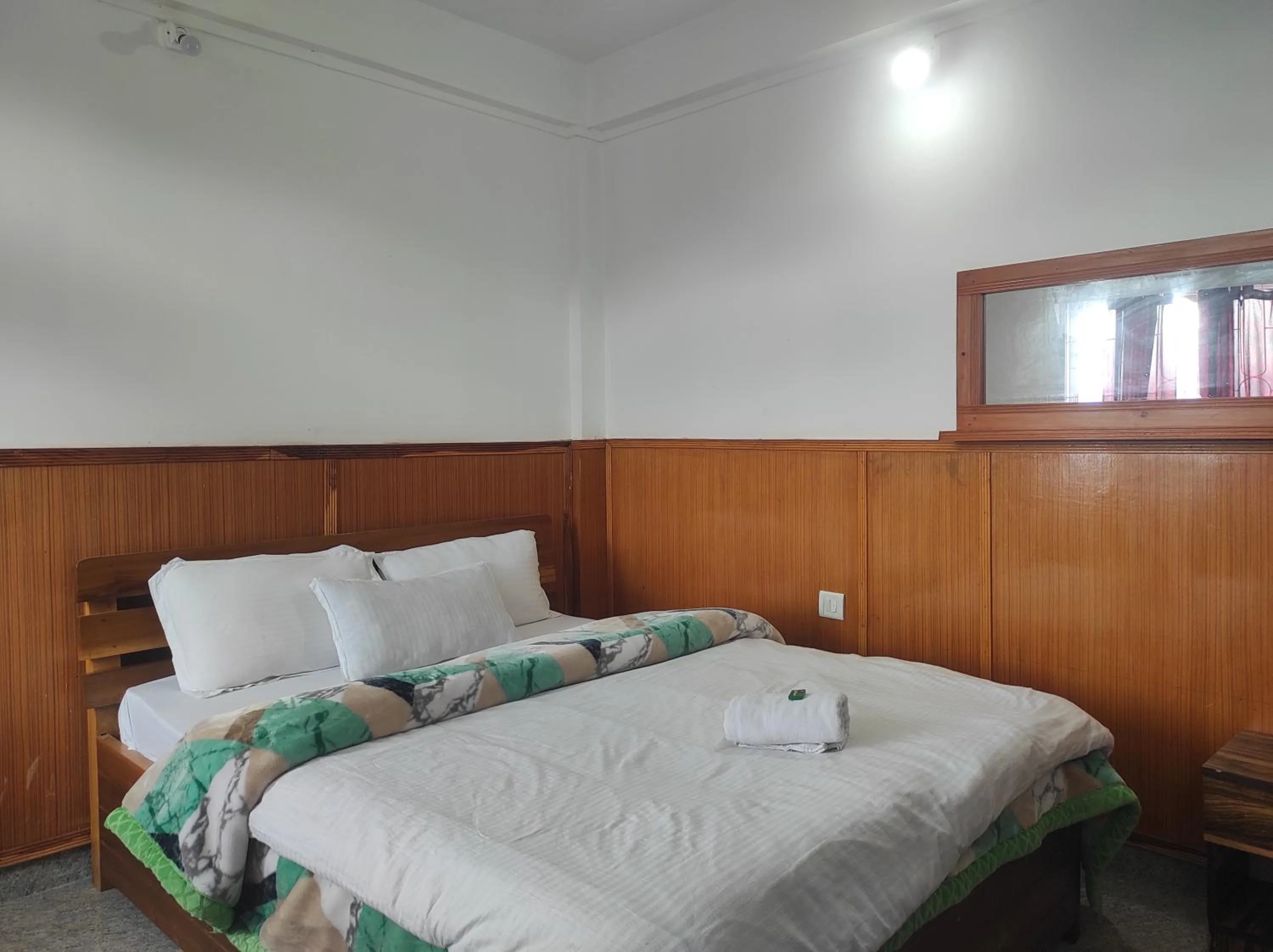 Bed in Hotel Tawang Regency