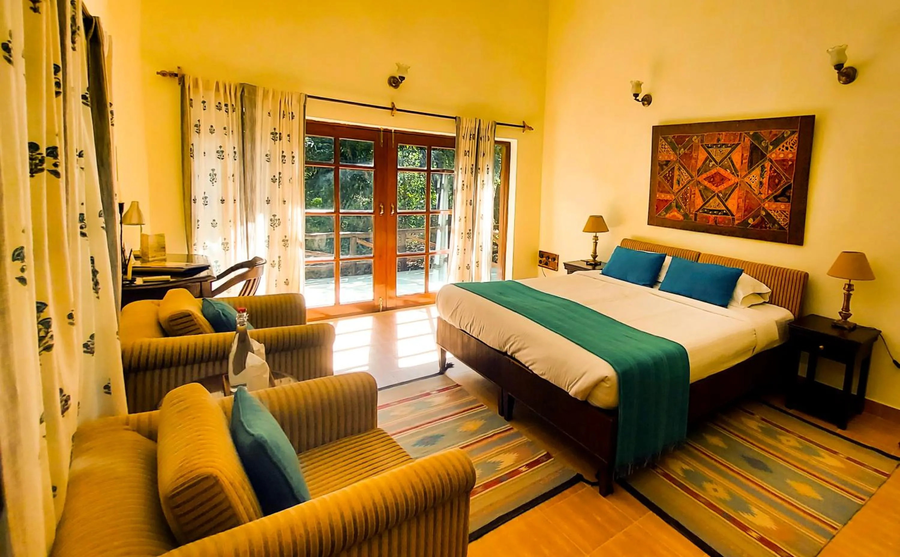 Living room, Bed in Bandhavgarh Jungle Lodge