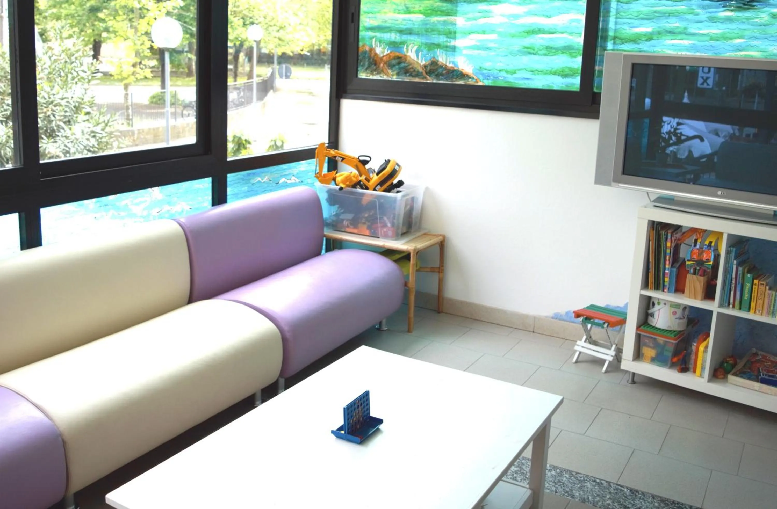 Communal lounge/ TV room in Hotel Lux