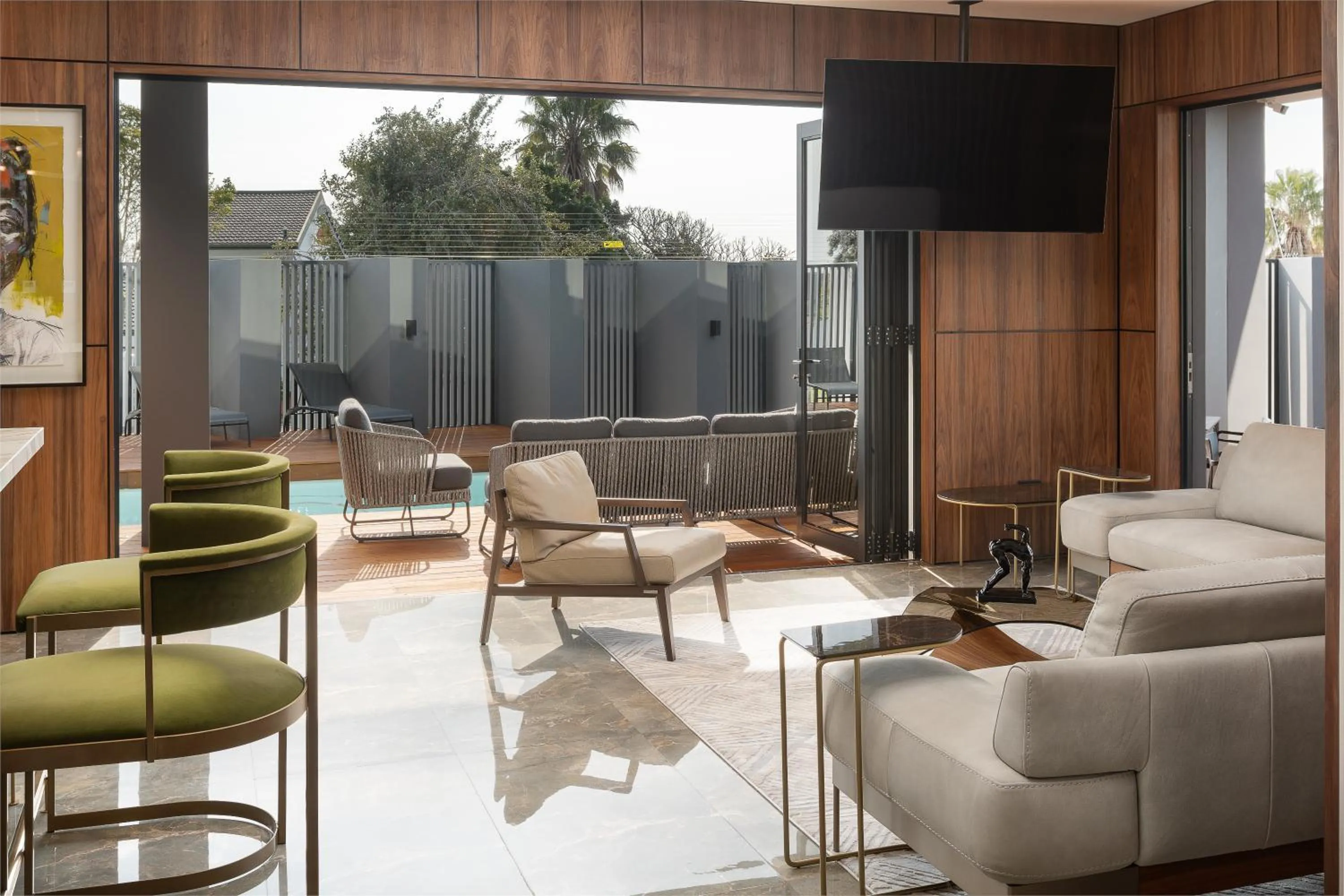 Communal lounge/ TV room in Anfani Boutique Hotel