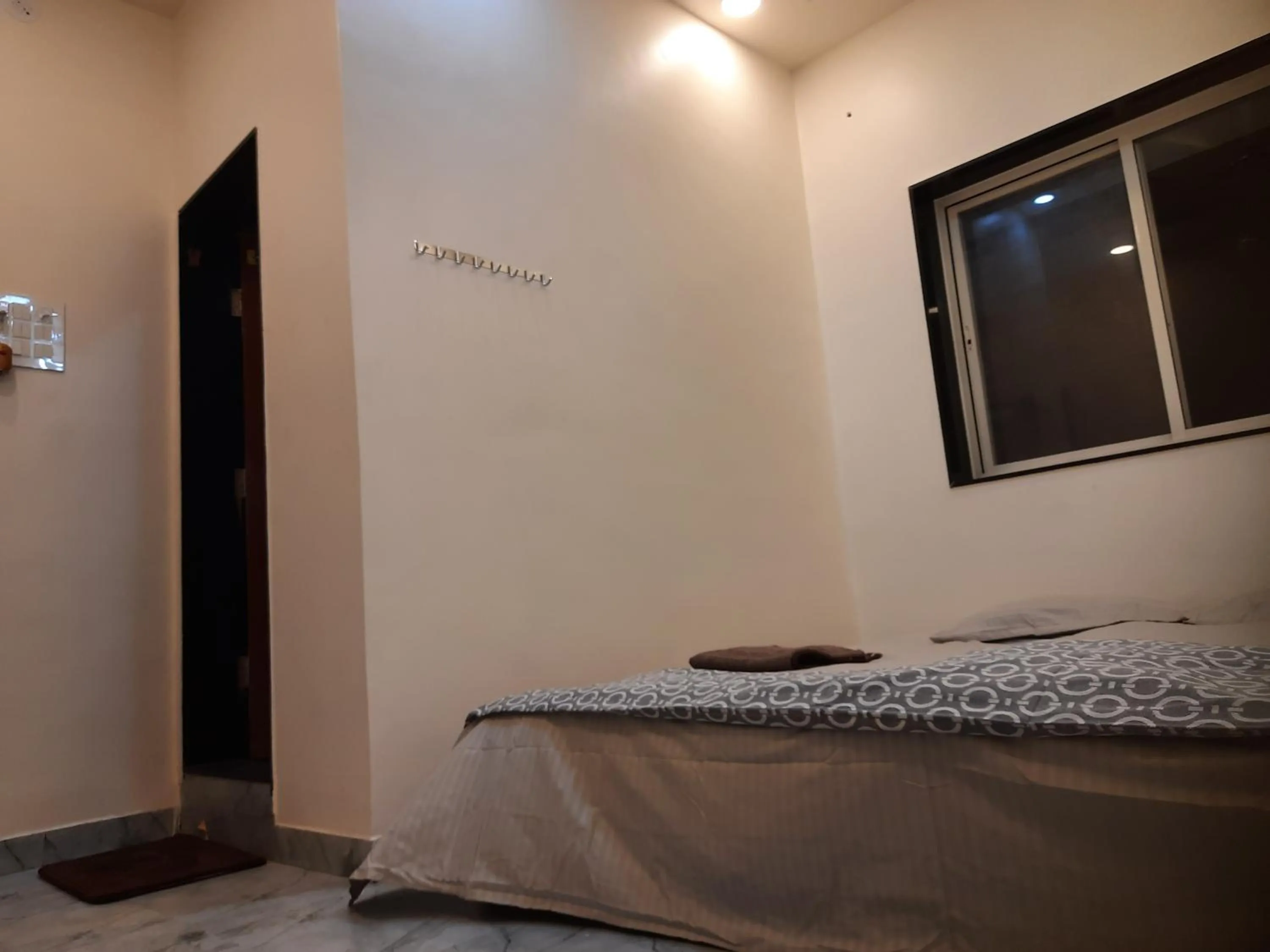 Bed in Shriguru Guest House Akkalkot