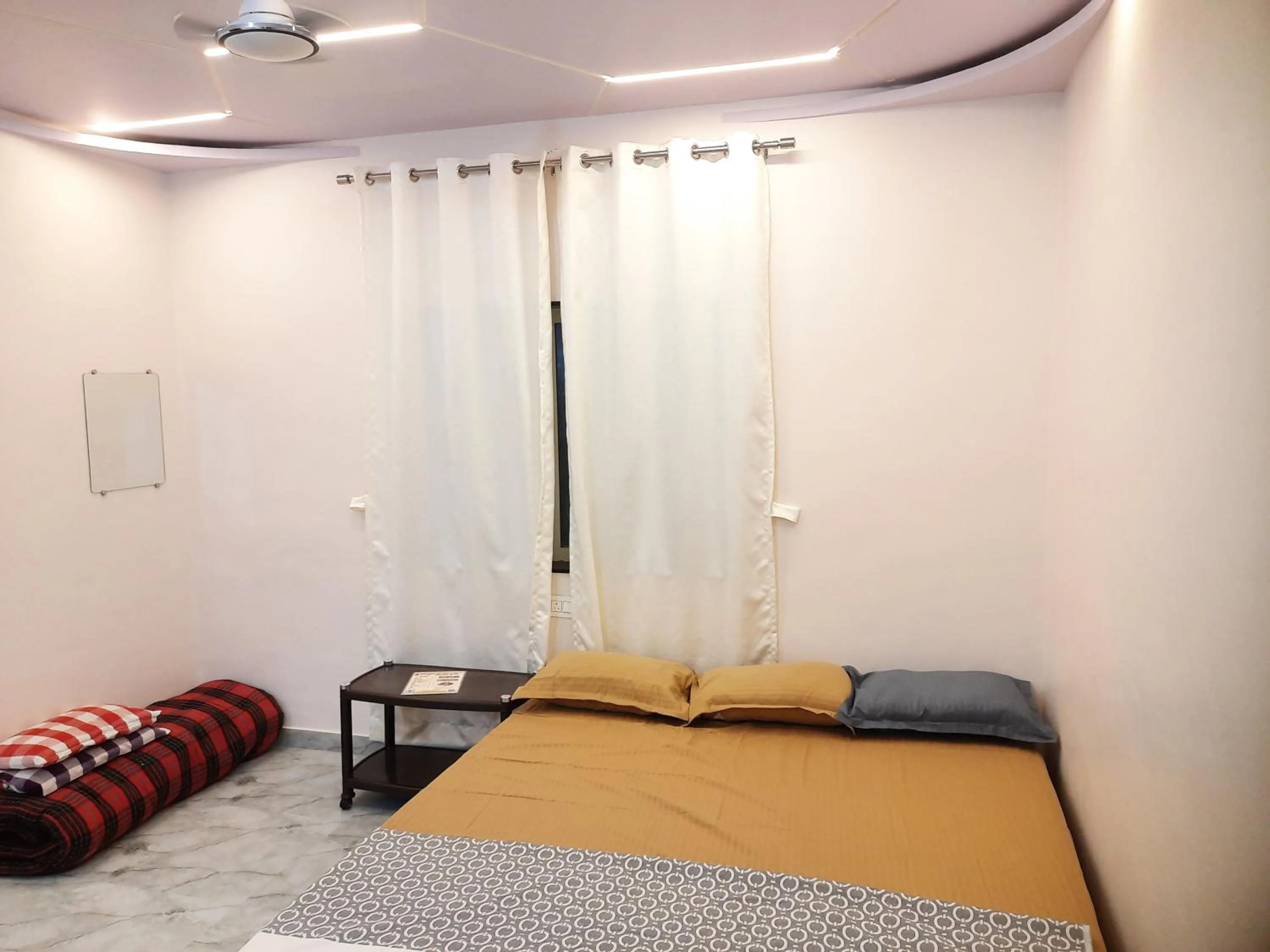 Bed in Shriguru Guest House Akkalkot