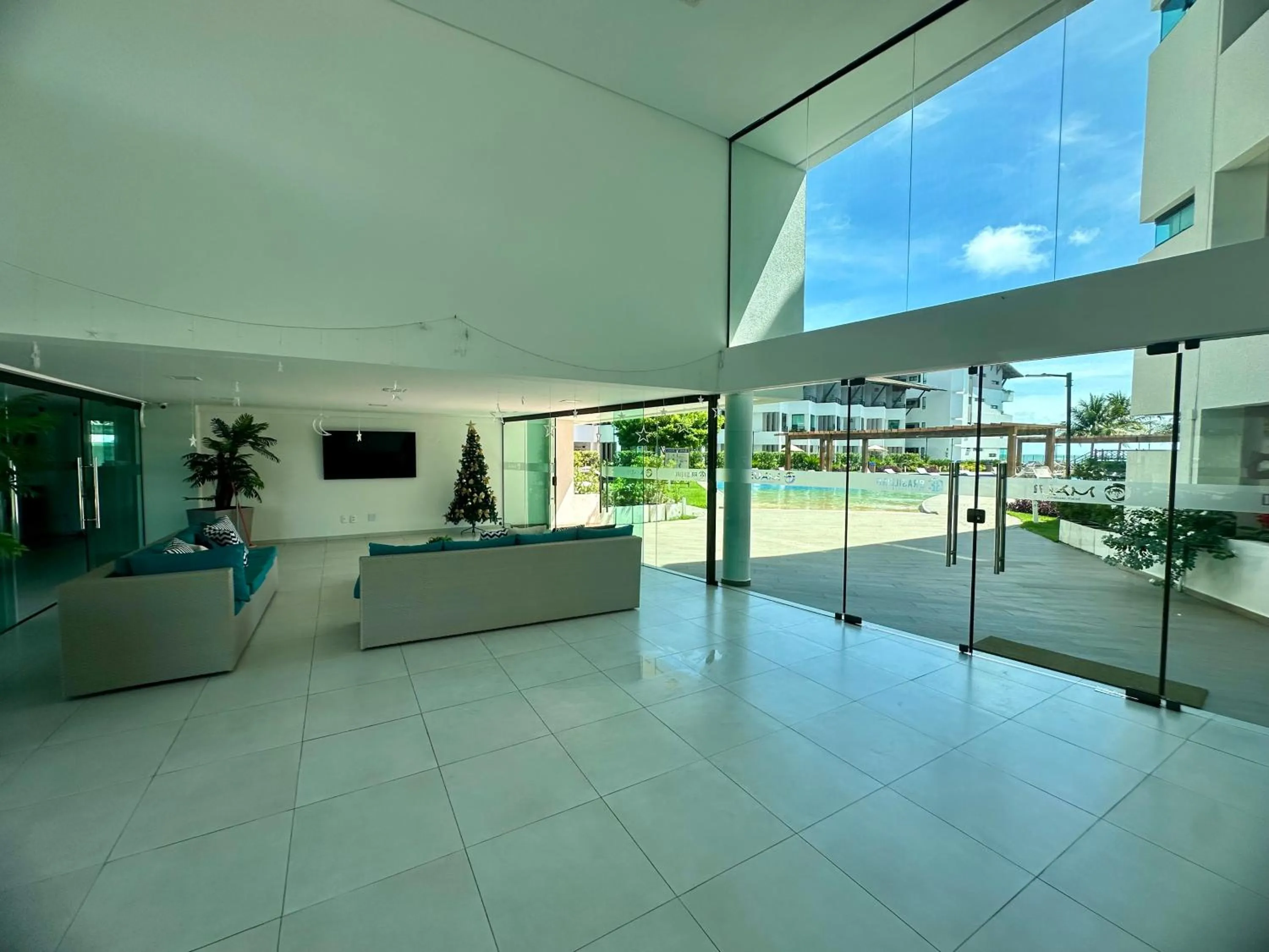 Communal lounge/ TV room in Flat Luxo - Pé na Areia - Maui Beach Residence