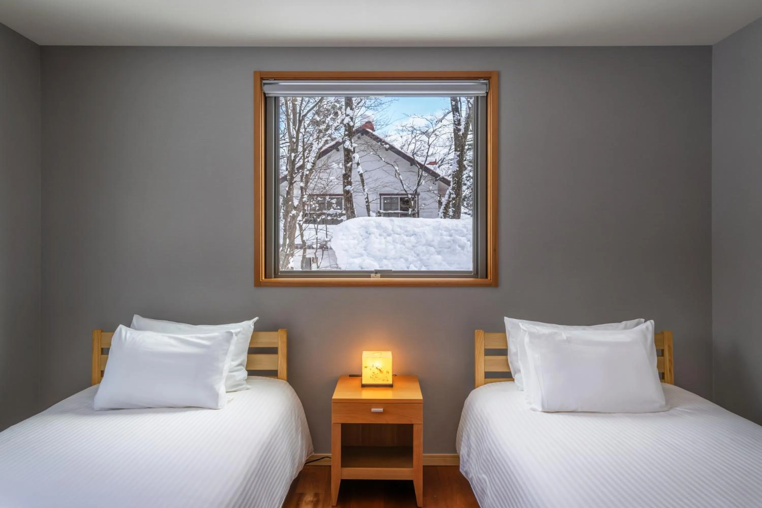 Bed in Bluebird Chalets by The Hakuba Collection