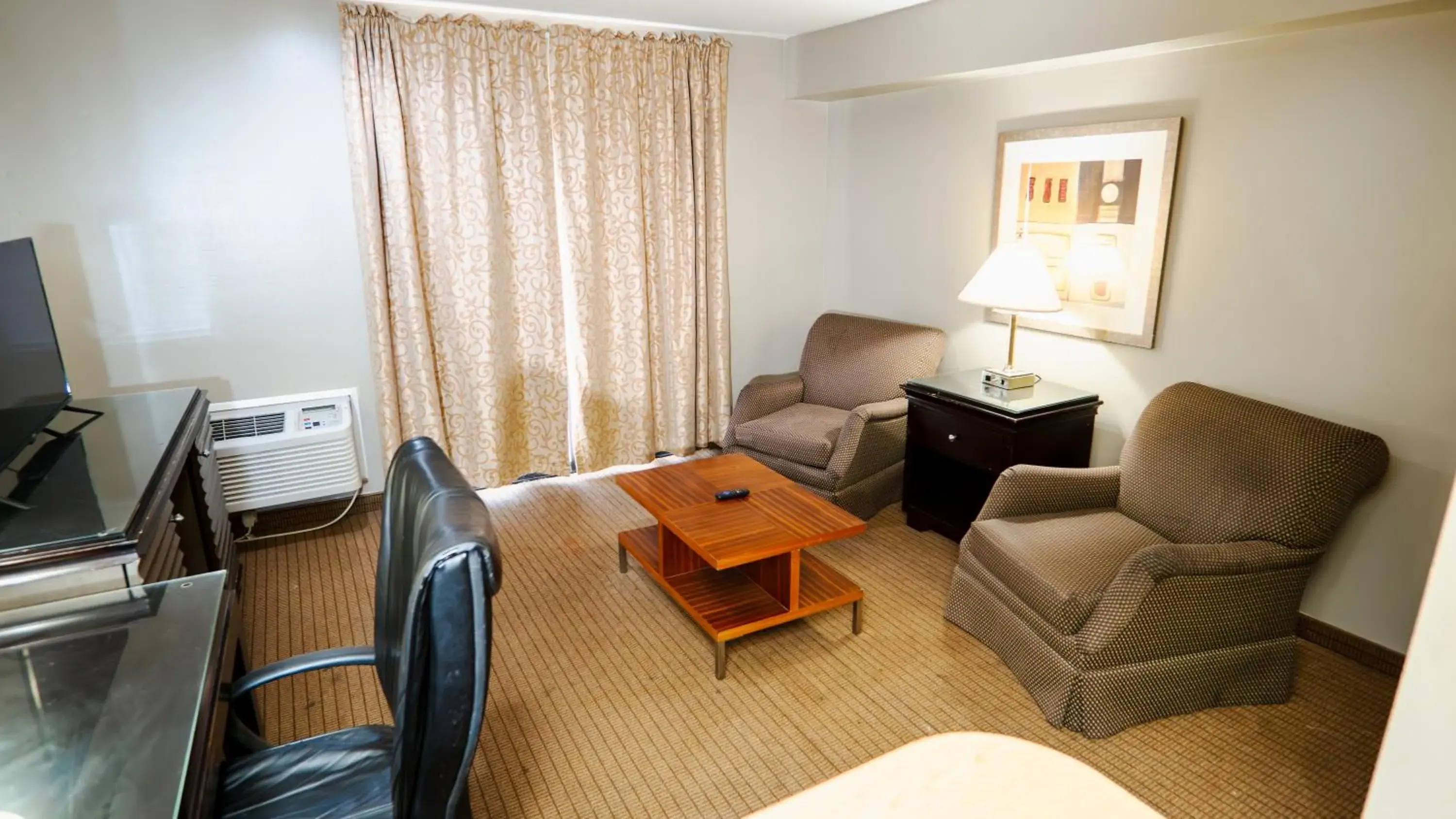 Living room in G T Hotels Inn & Suites Extended Stay Living room in G T Hotels Inn & Suites Extended Stay