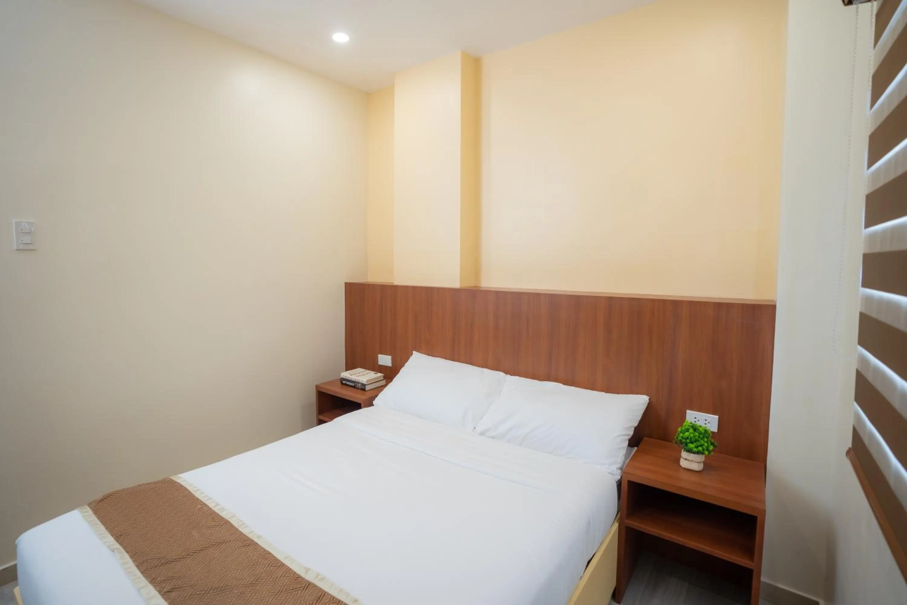 Bed in Sundaze Hotel