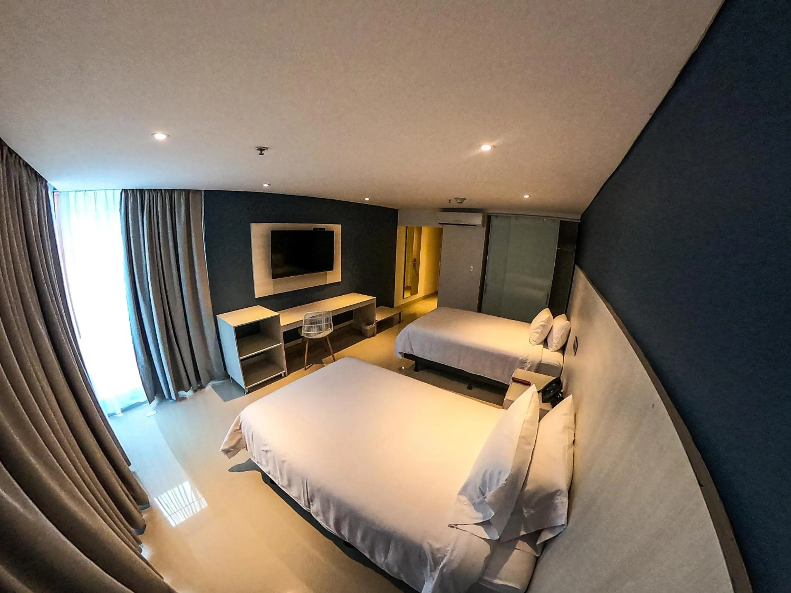 Communal lounge/ TV room, Bed in HOTEL MANZUR