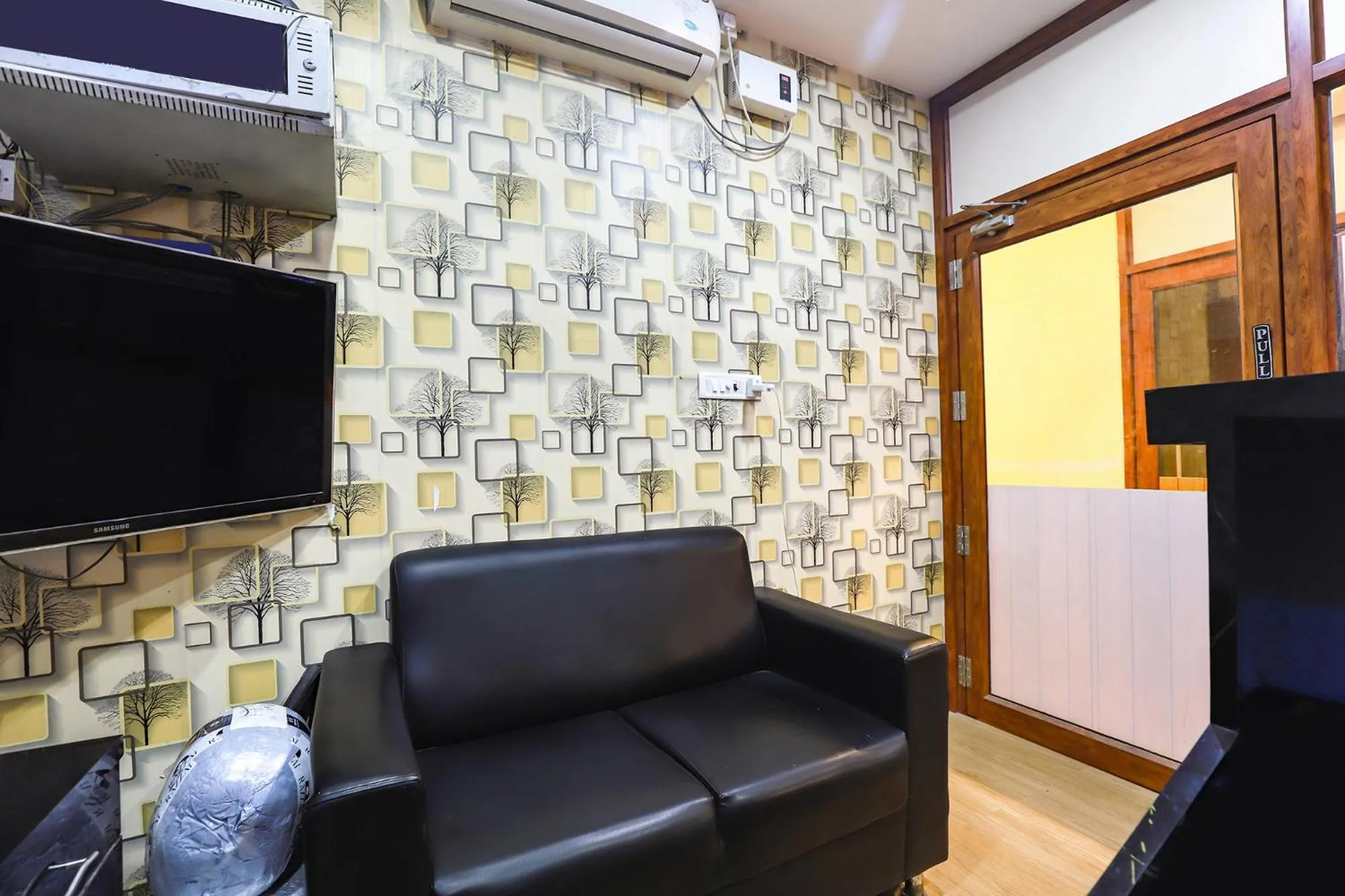 Seating area in FabHotel Joy Residency