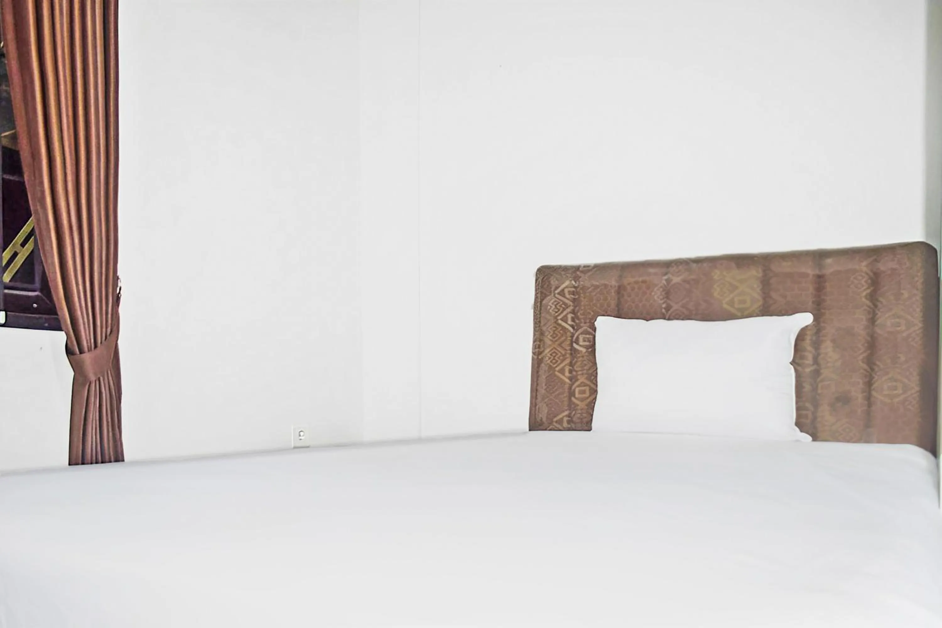 Bedroom in Super OYO 93085 Homy Stay Syariah