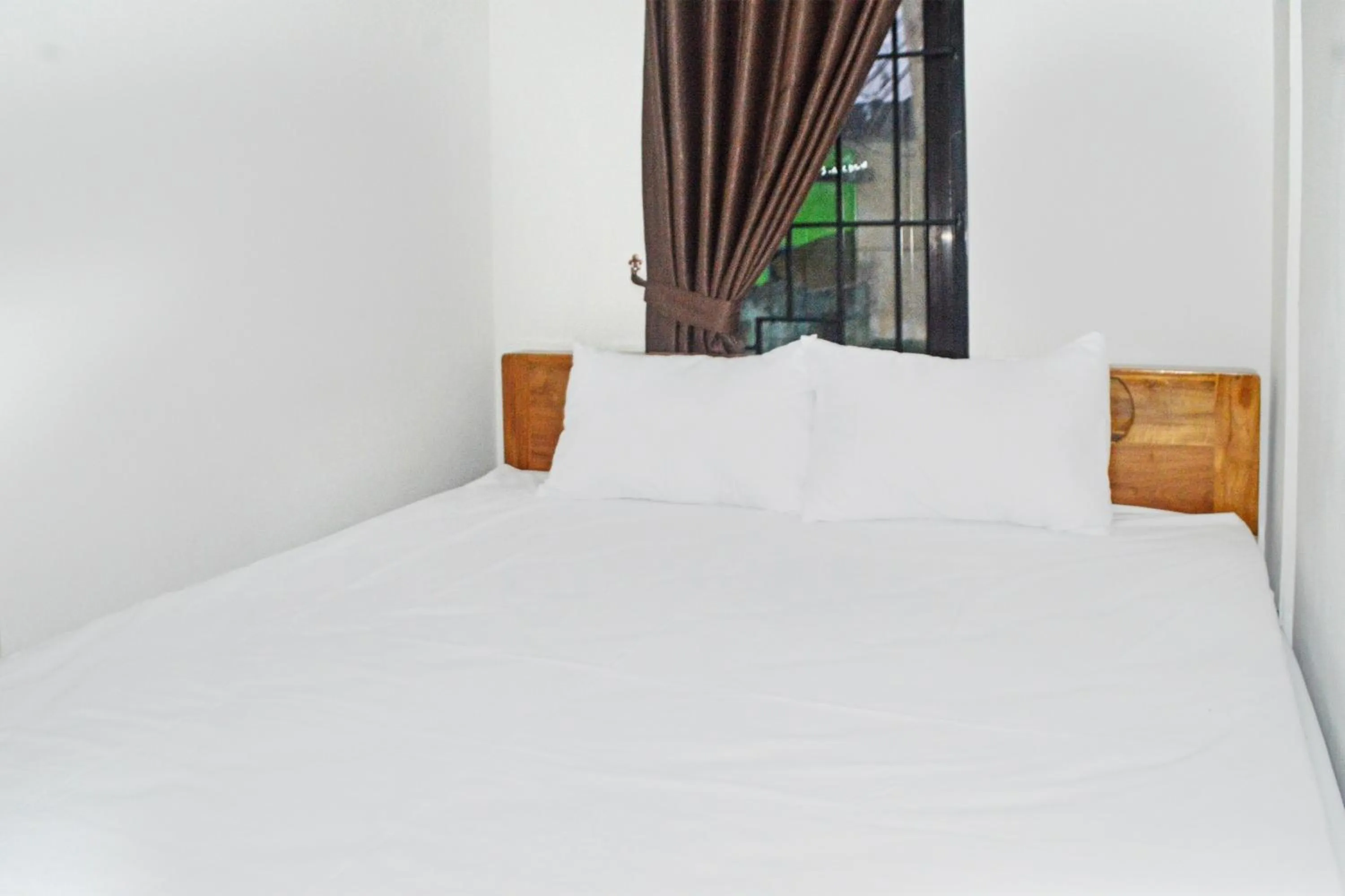 Bedroom in Super OYO 93085 Homy Stay Syariah