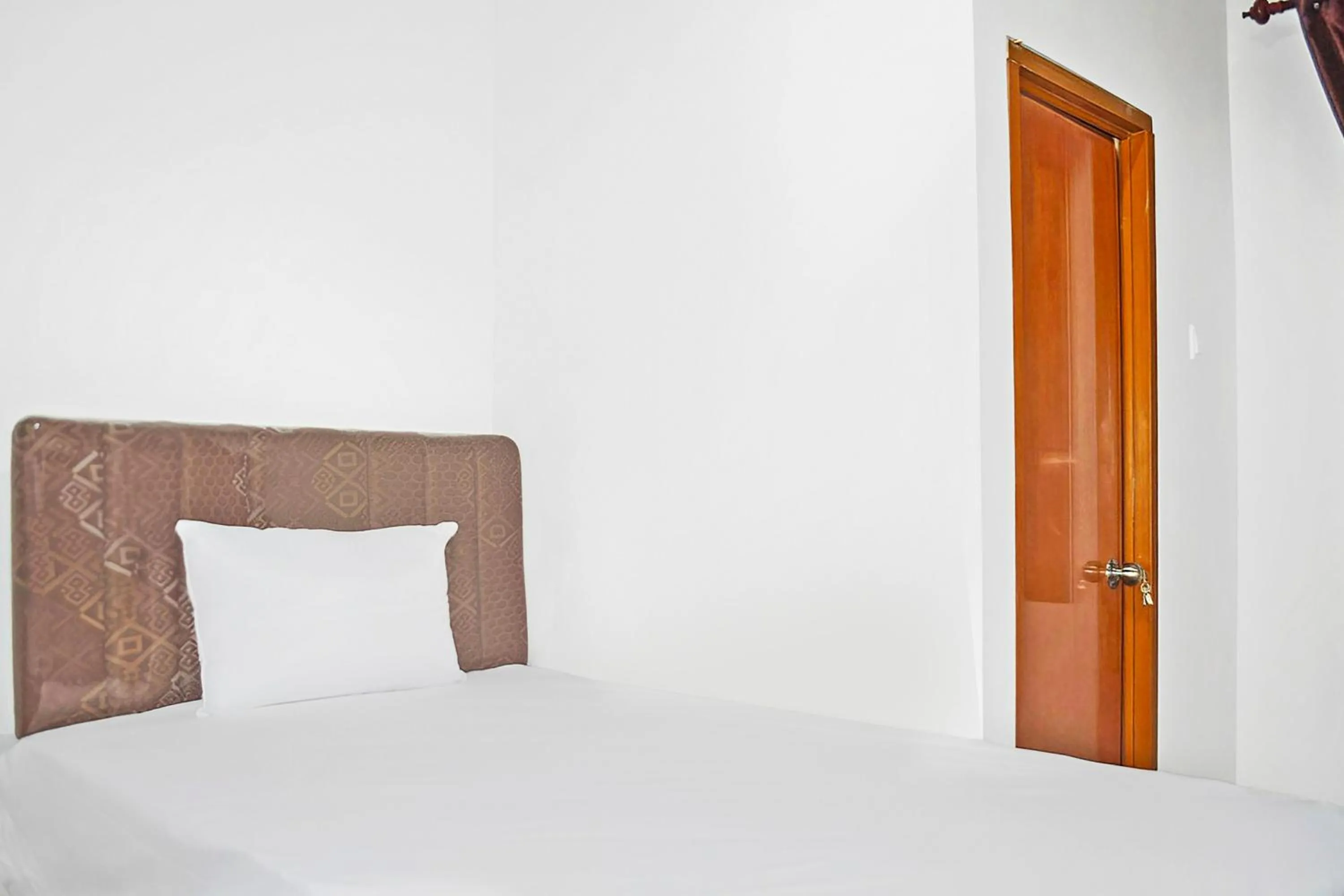 Bedroom in Super OYO 93085 Homy Stay Syariah