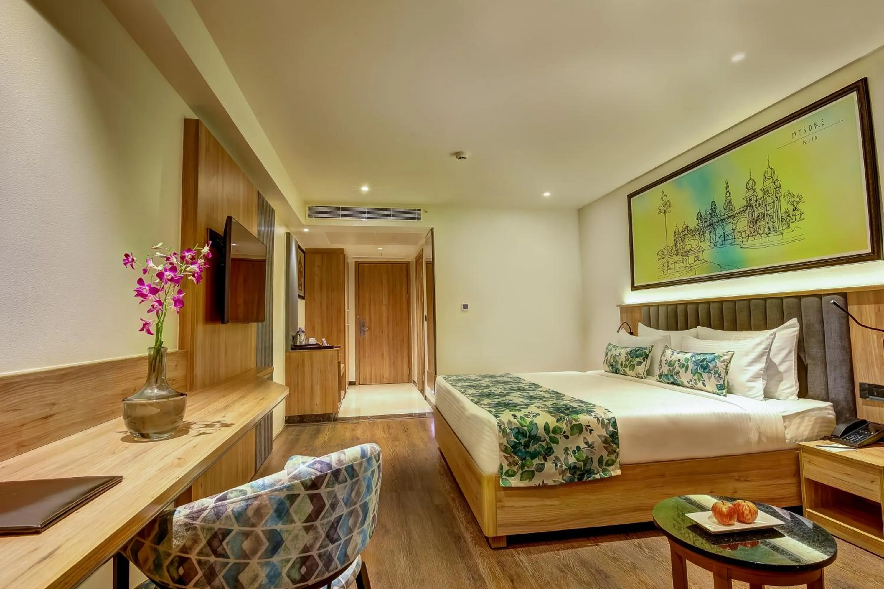 Photo of the whole room, Bed in Regenta Central Javaji Mysore