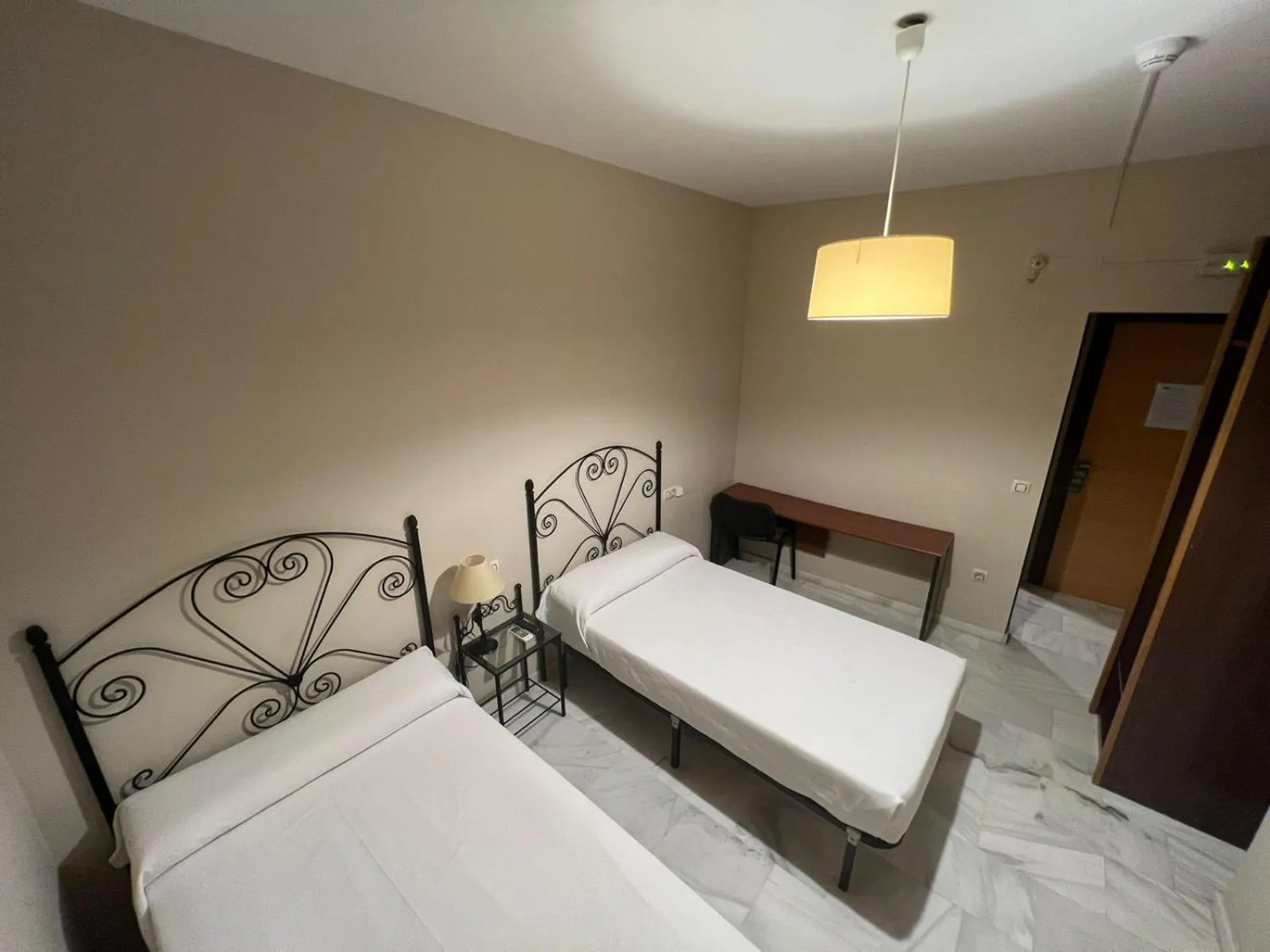 Bed in Hostal el Pasaje