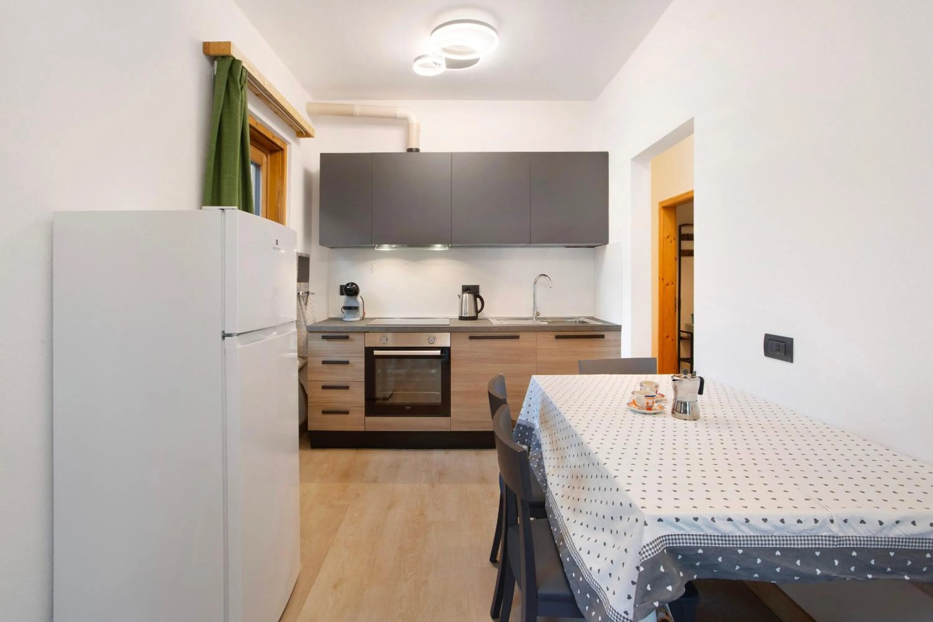 Kitchen or kitchenette in Appartamento Arlecchino Livigno