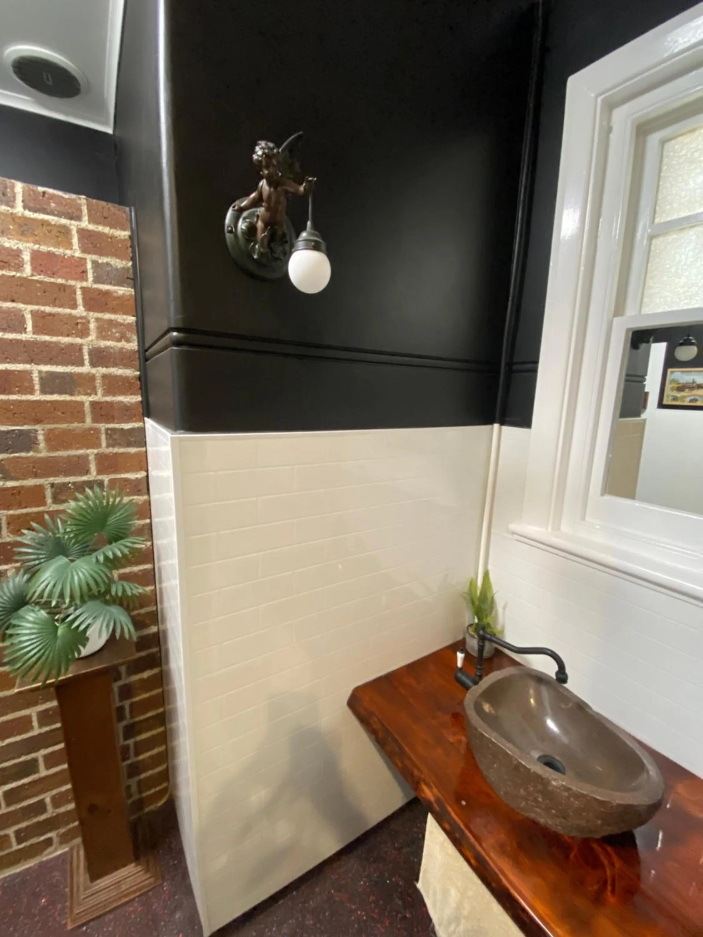 Bathroom in COMMERCIAL HOTEL KANIVA call to save dollars