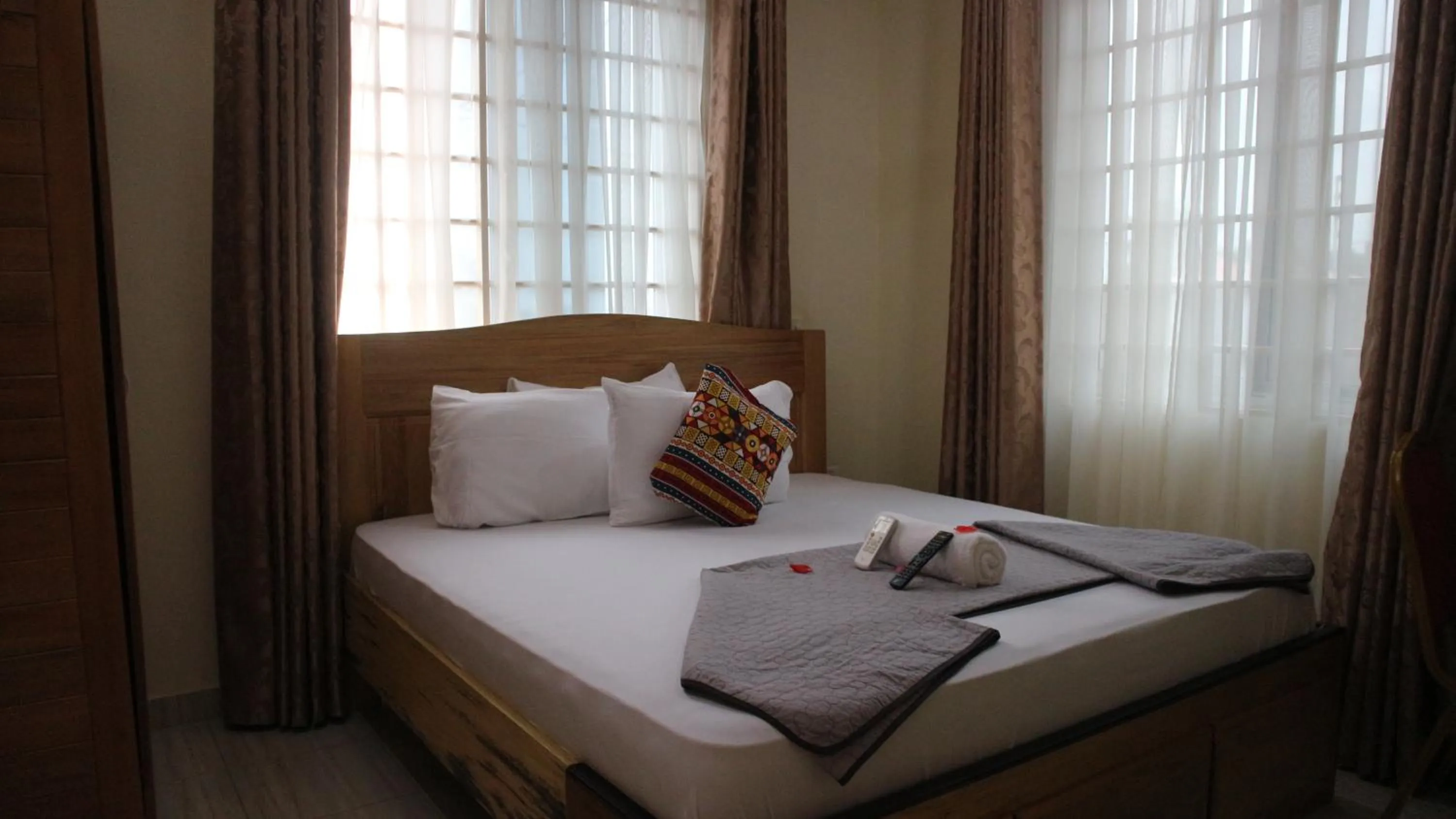 Bed in Crystal Premier Hotel