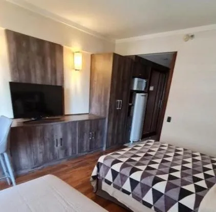 Bed in Grand Plaza Paulista Hotel