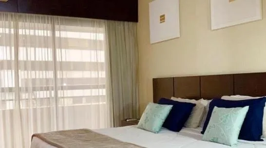 Bed in Grand Plaza Paulista Hotel