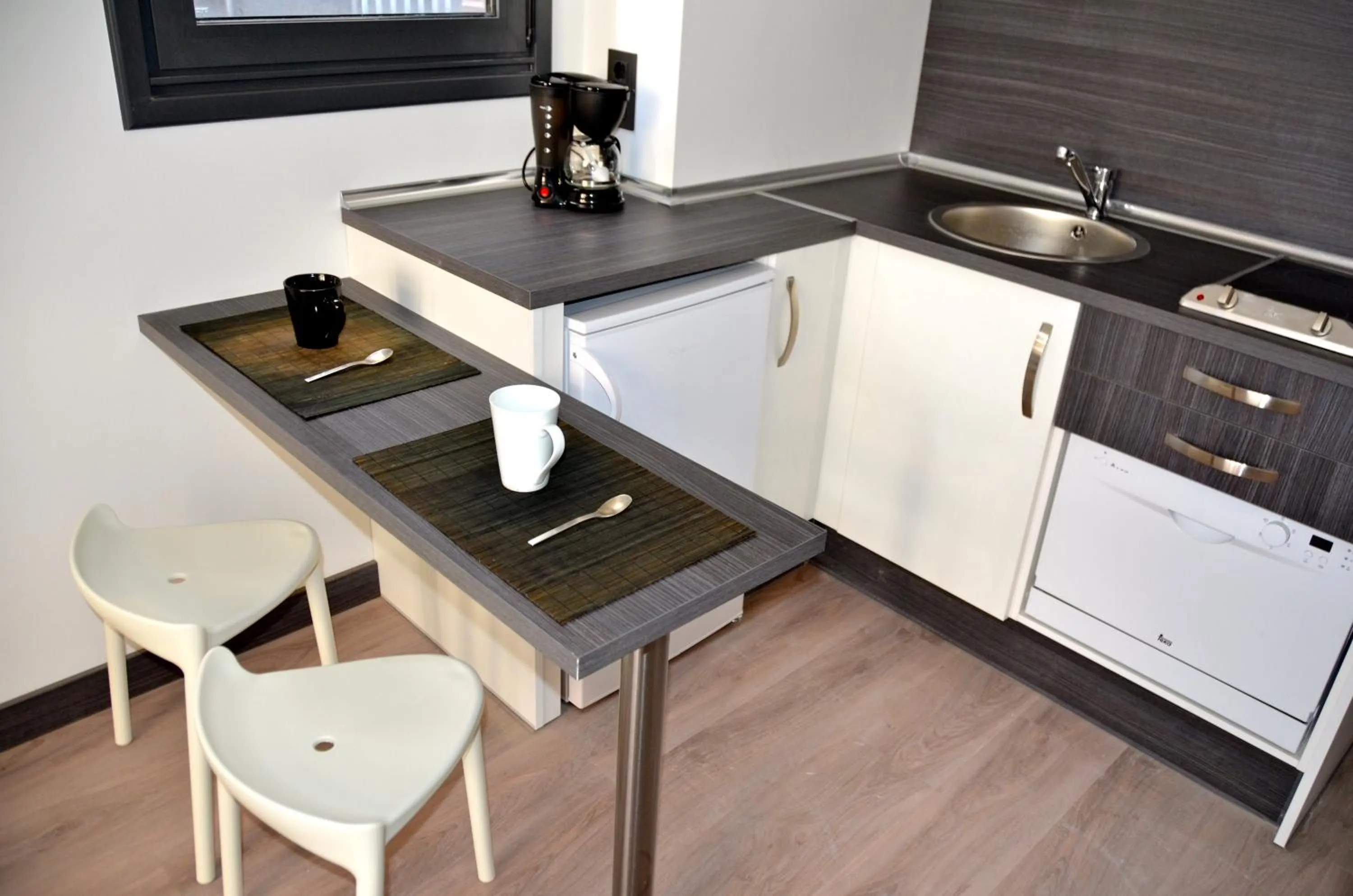Kitchen or kitchenette in Apartamentos Capua