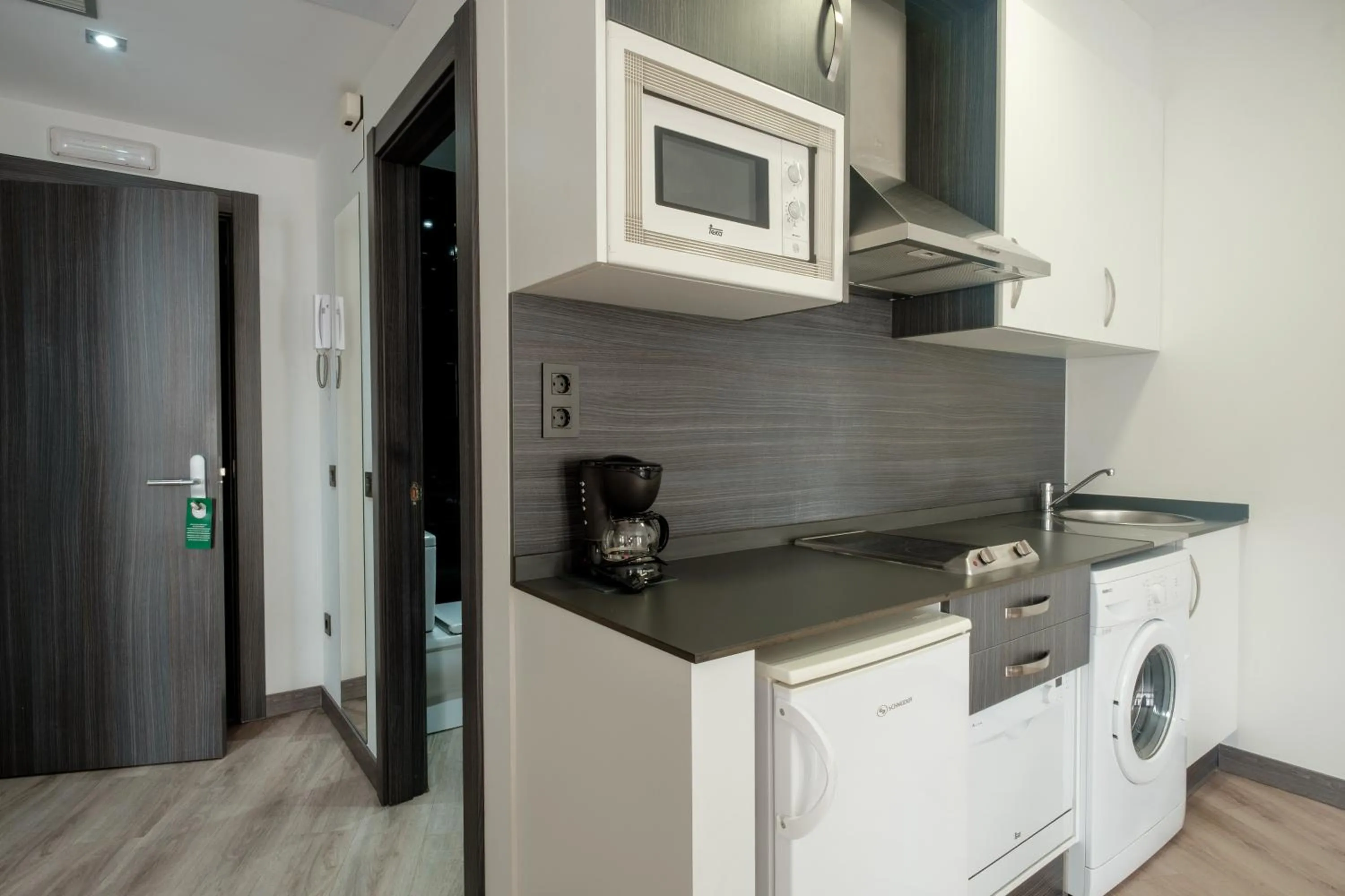 Kitchen or kitchenette in Apartamentos Capua