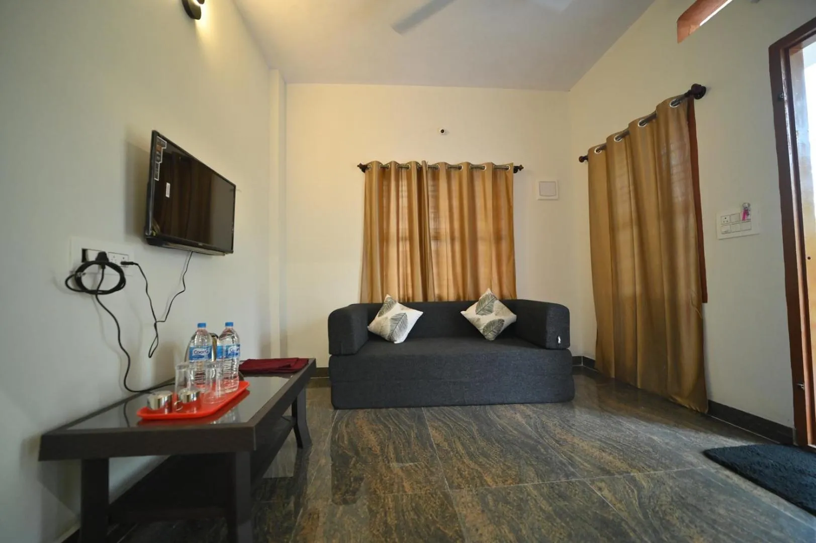 Communal lounge/ TV room, Bed in Coorg HomeStay Resort