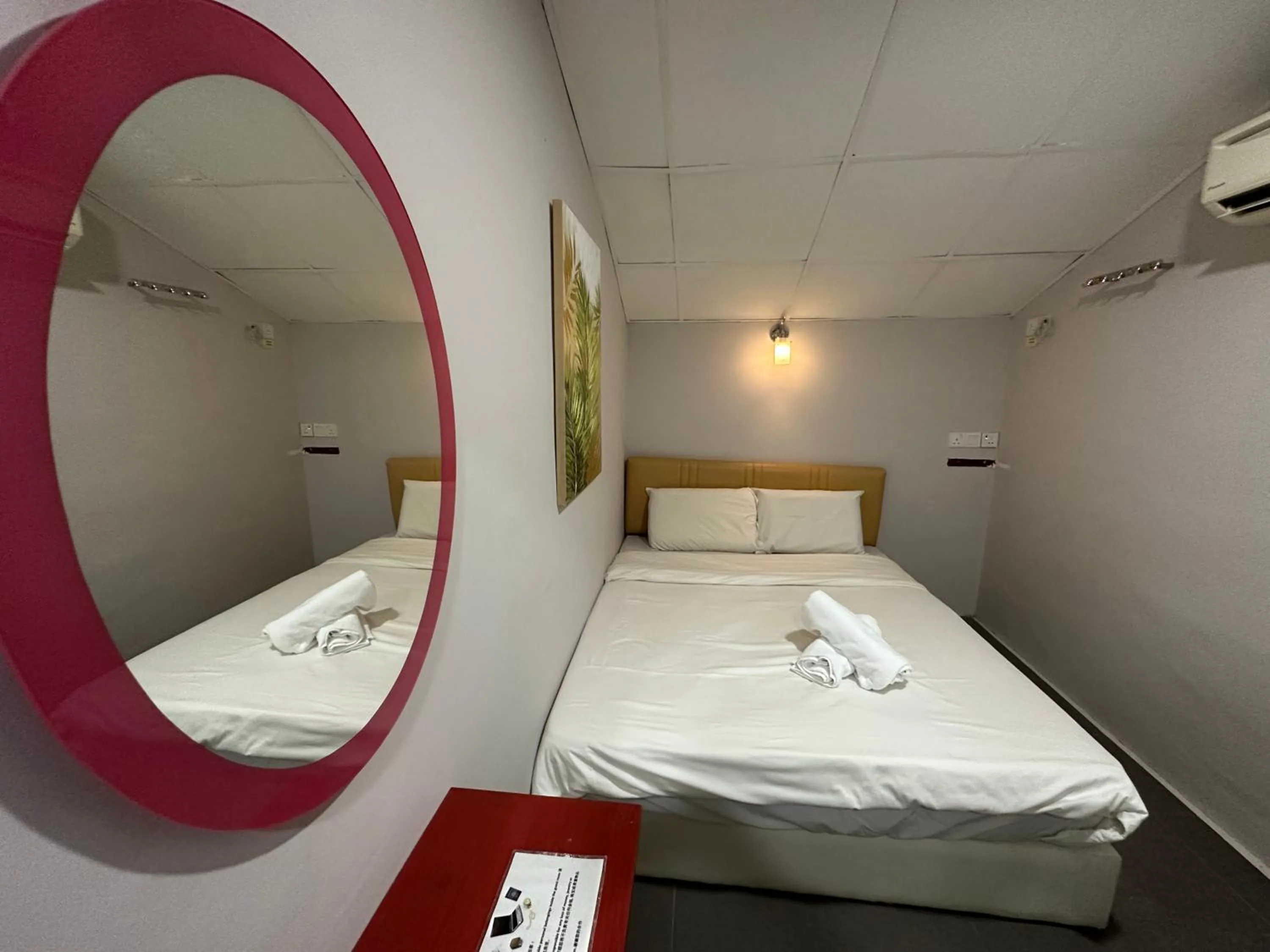 Bed in Dingdong Homes Hotel