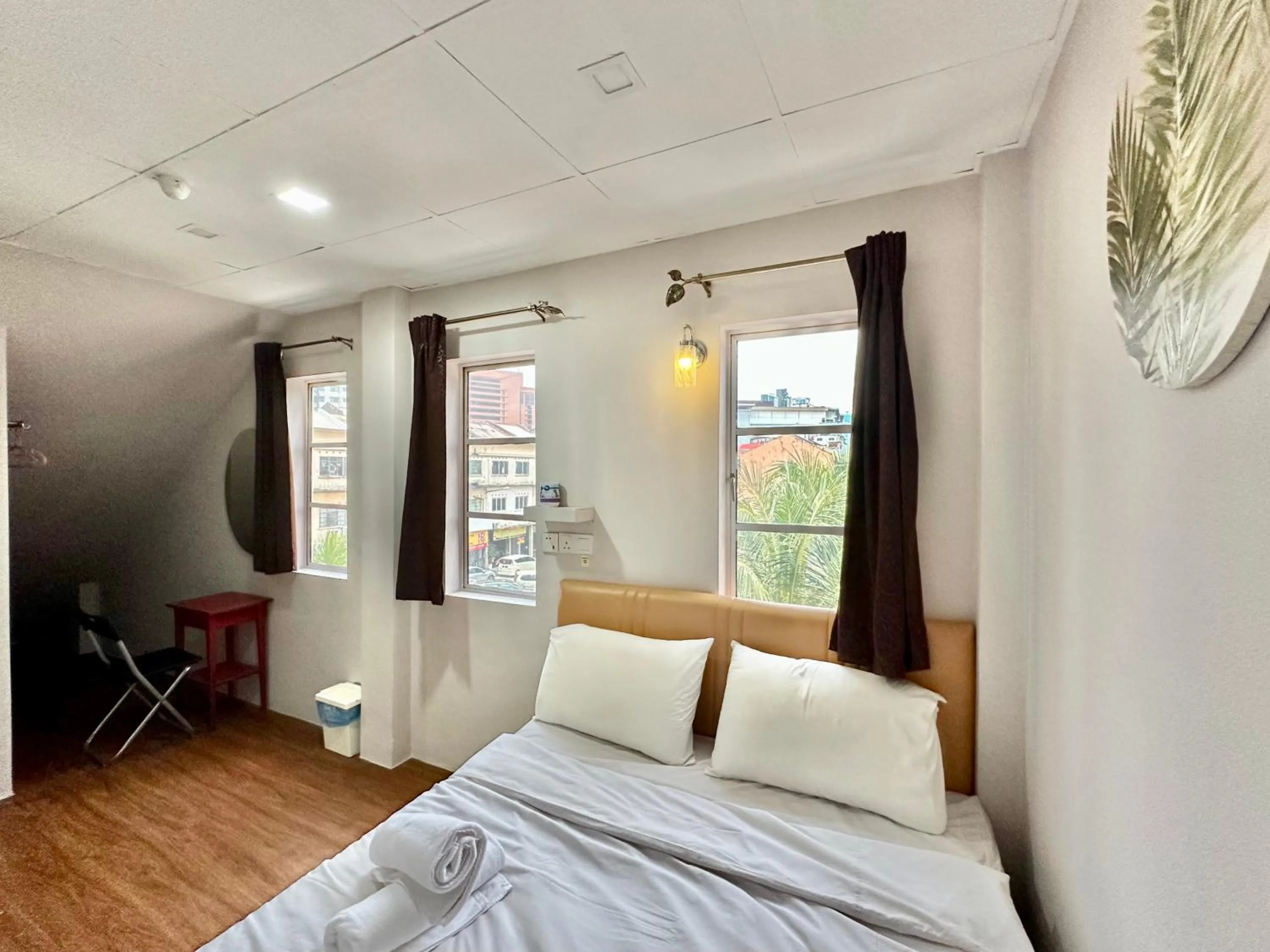 Bed in Dingdong Homes Hotel