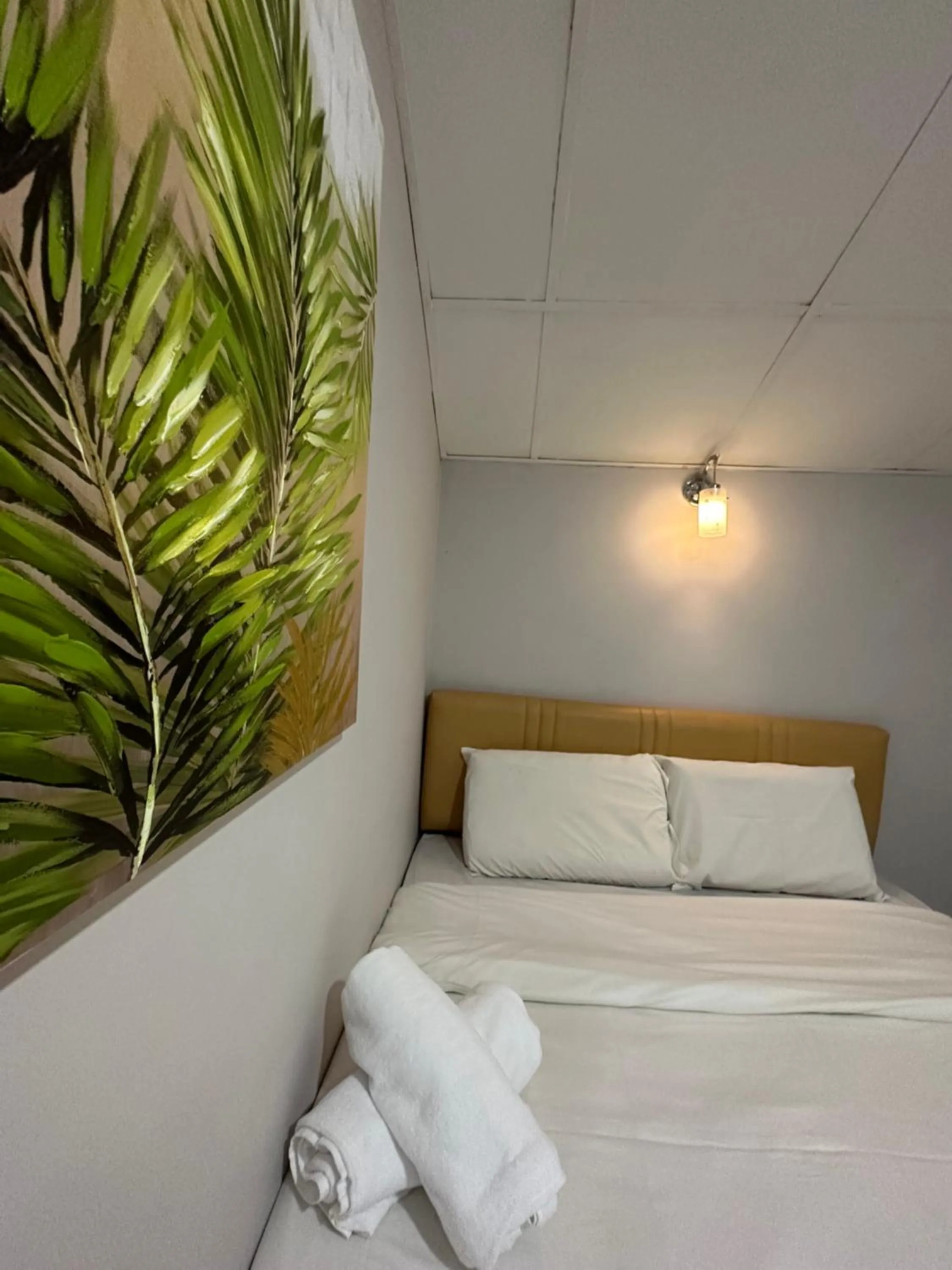 Bed in Dingdong Homes Hotel