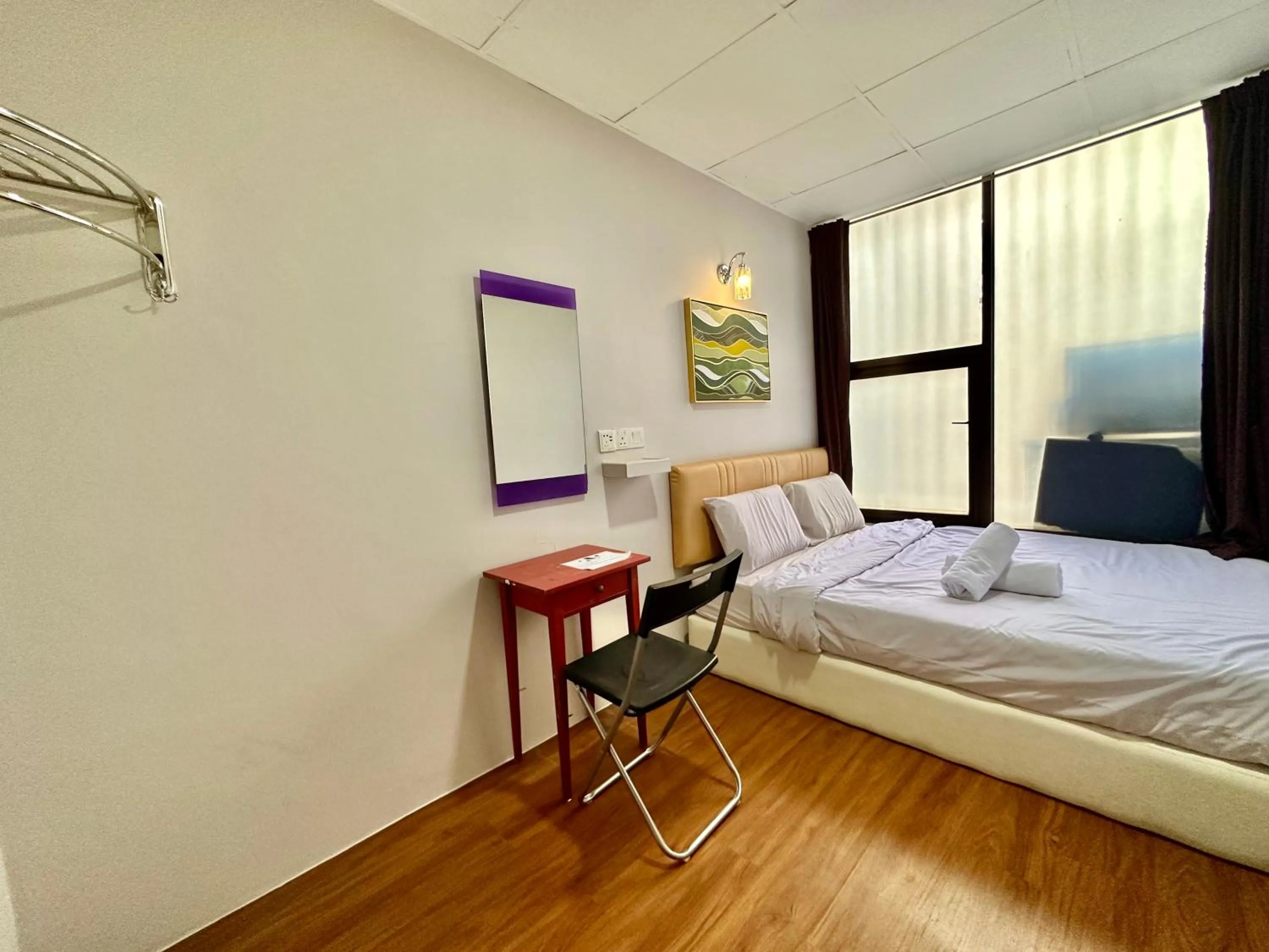 Bed in Dingdong Homes Hotel