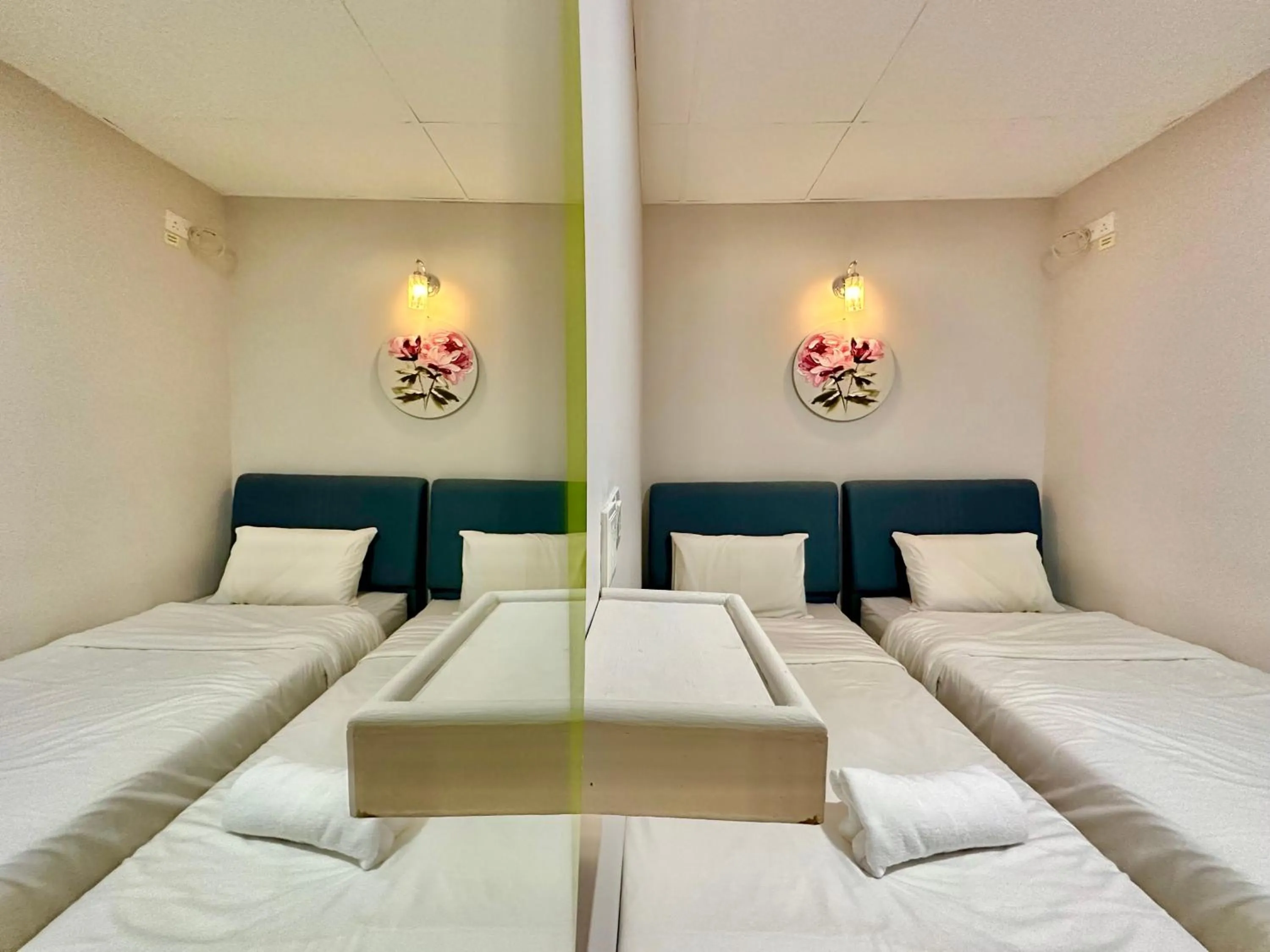 Bed in Dingdong Homes Hotel