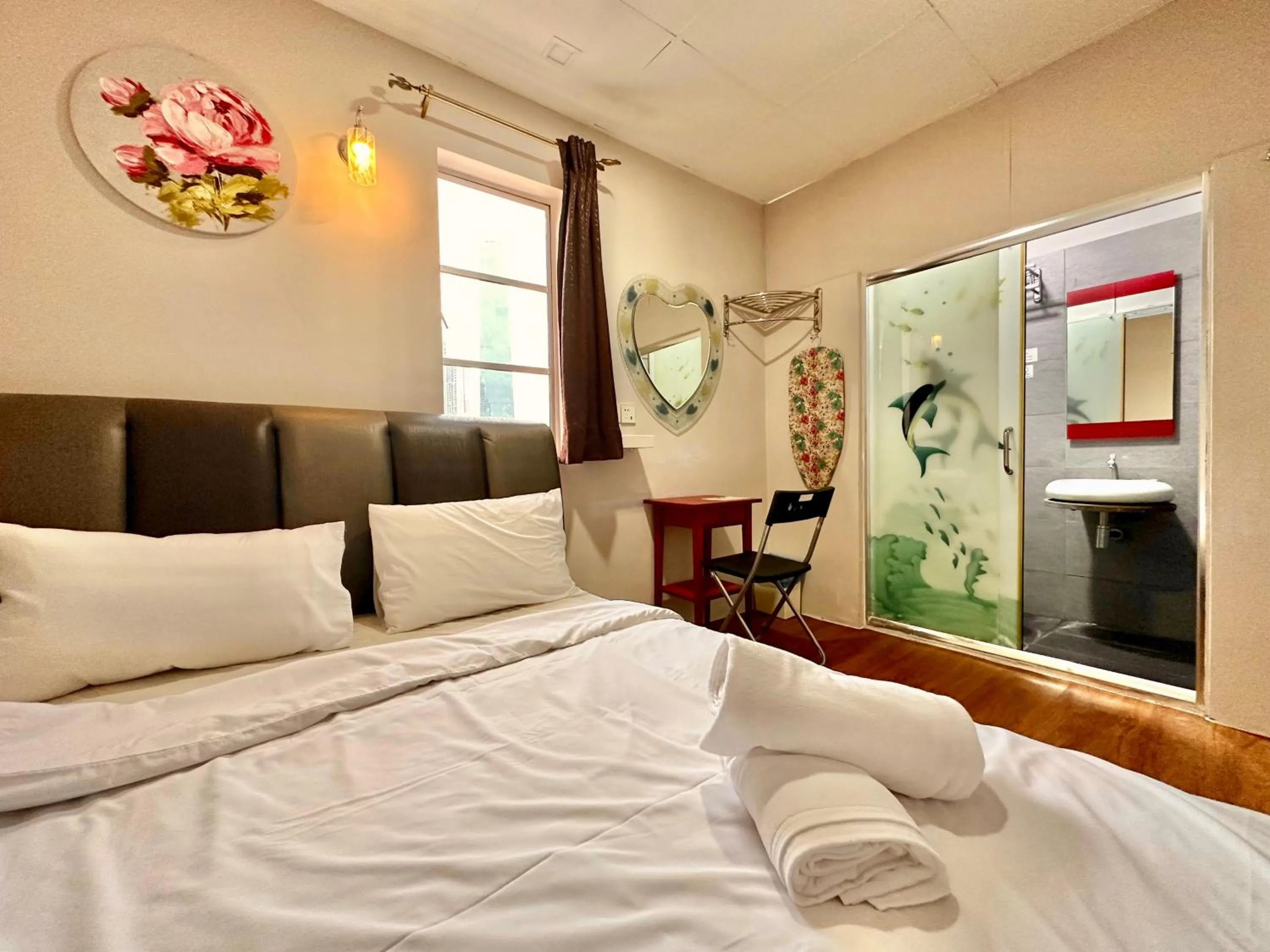 Bed in Dingdong Homes Hotel
