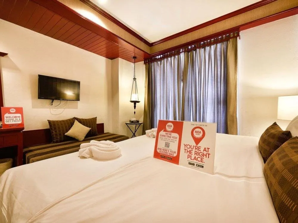 Bed in THE TOP PATONG RESORT.