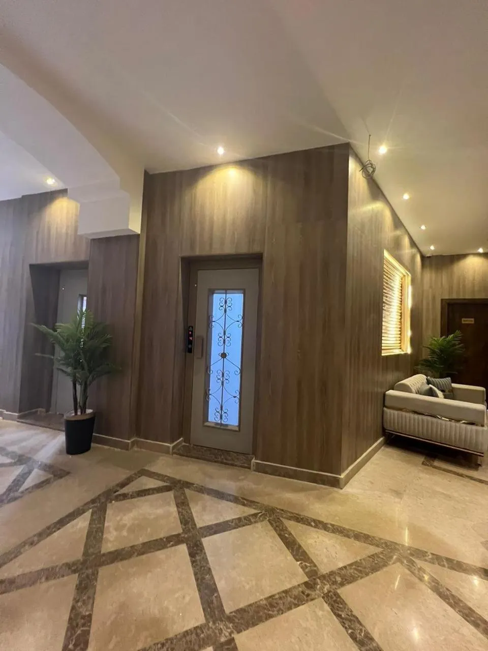 elevator, Bed in Rotana Palace Suites